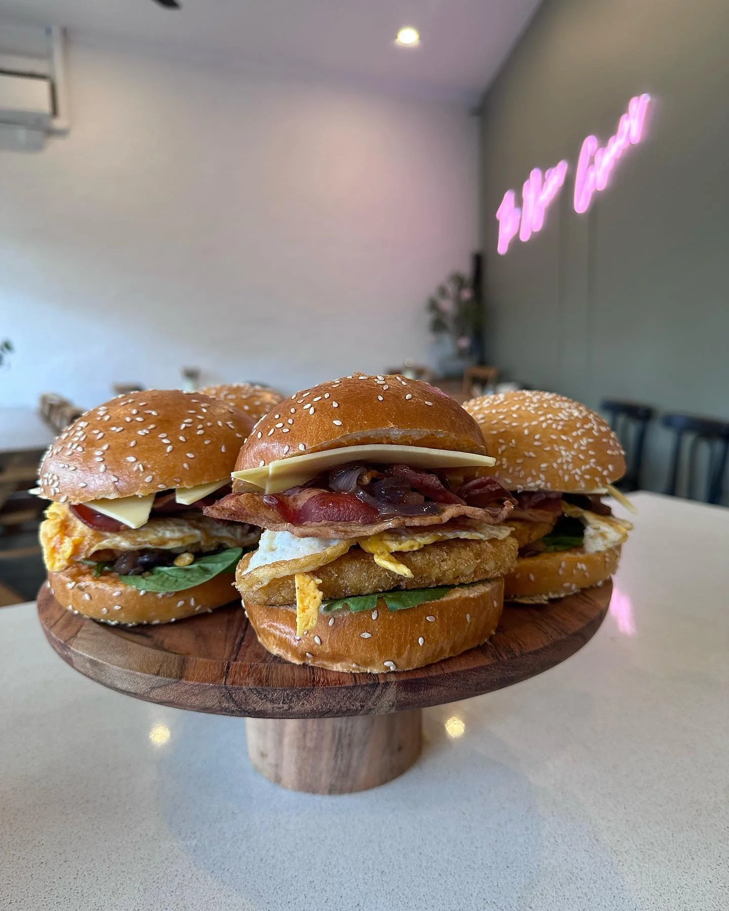 Breakfsat burger with bacon, egg, hashbrown, cheese, caramalised onion and spinach.