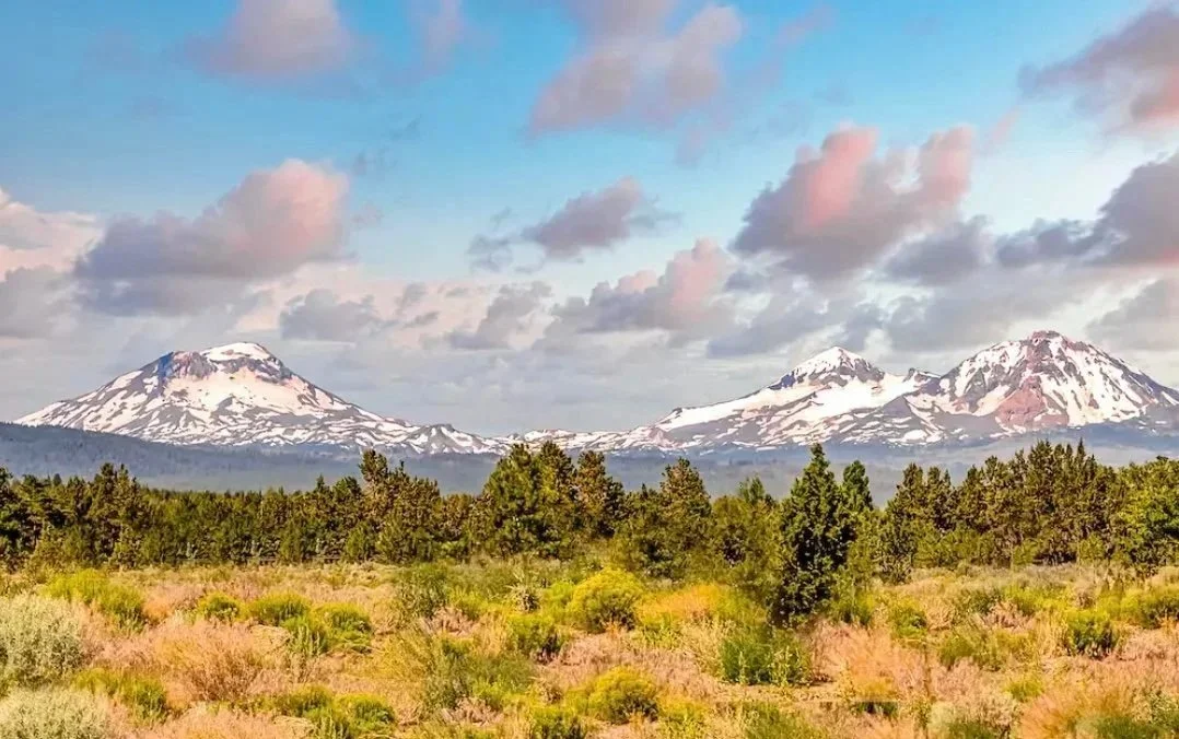 View of the Three Sisters mountains from outside of Six Mountain View in Sisters, Oregon