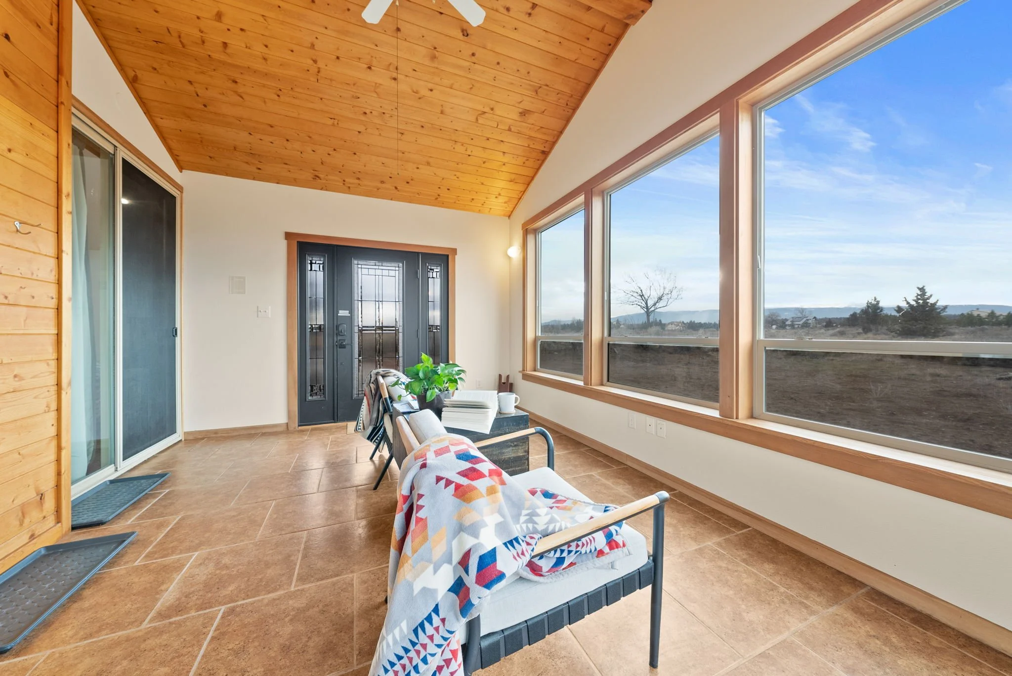 Image of entryway sun room with views out to the mountains
