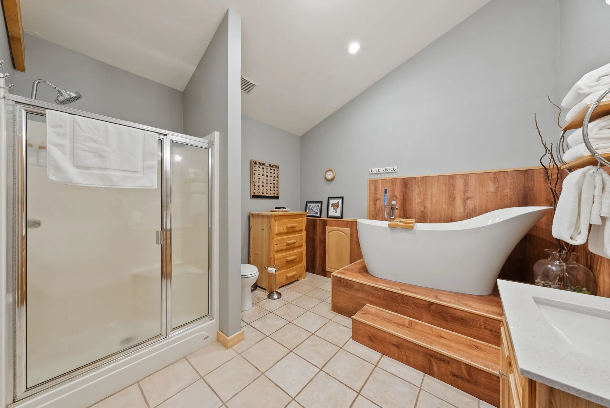 Image of main floor bathroom with shower and soaking tub at Six Mountain View in Sisters, Oregon