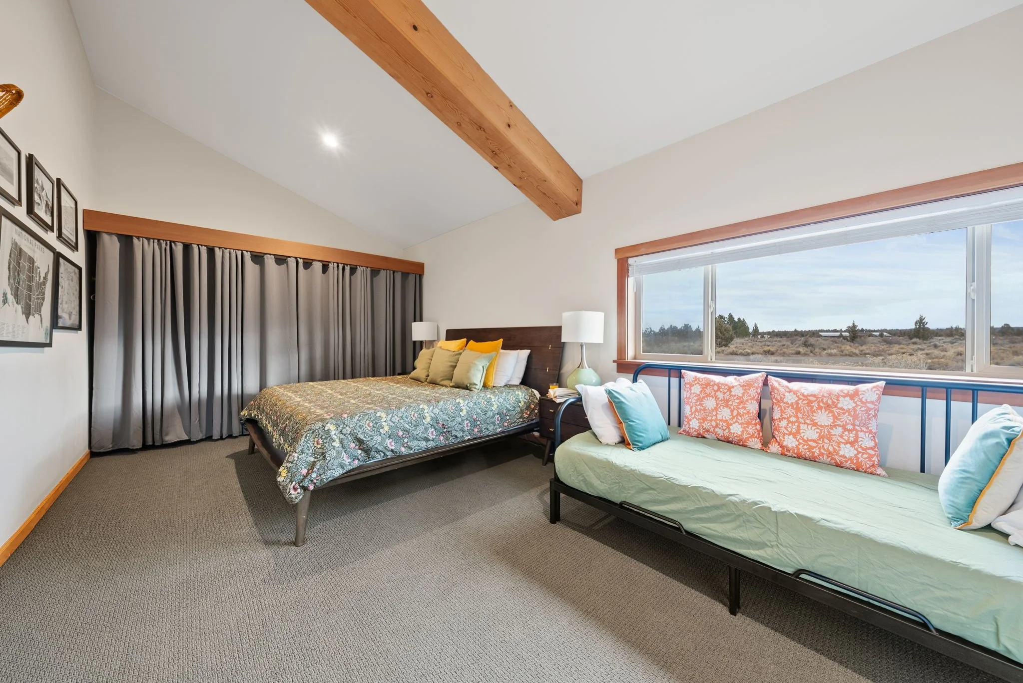Image of the primary bedroom with king size bed and twin bed at Six Mountain View in Sisters, Oregon