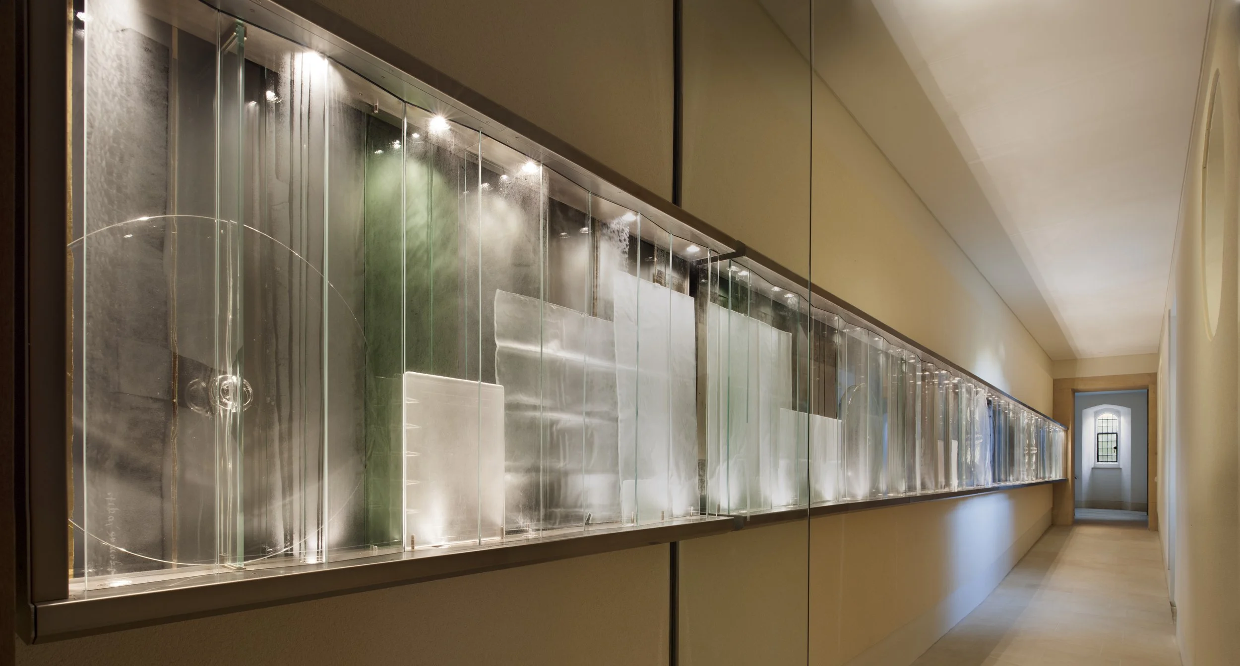 Multi media glass sculture in a University corridor.