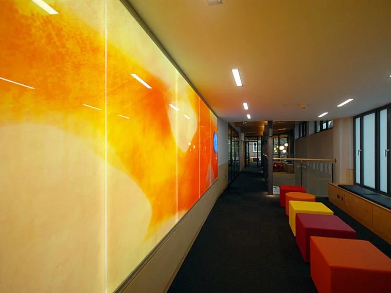 St Clare's College, Oxford back-lit enamelled glass feature wall by Martin Donlin