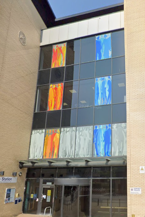 Screen printed and etched silhouettes at Poole Police Station facade designed by Martin Donlin.