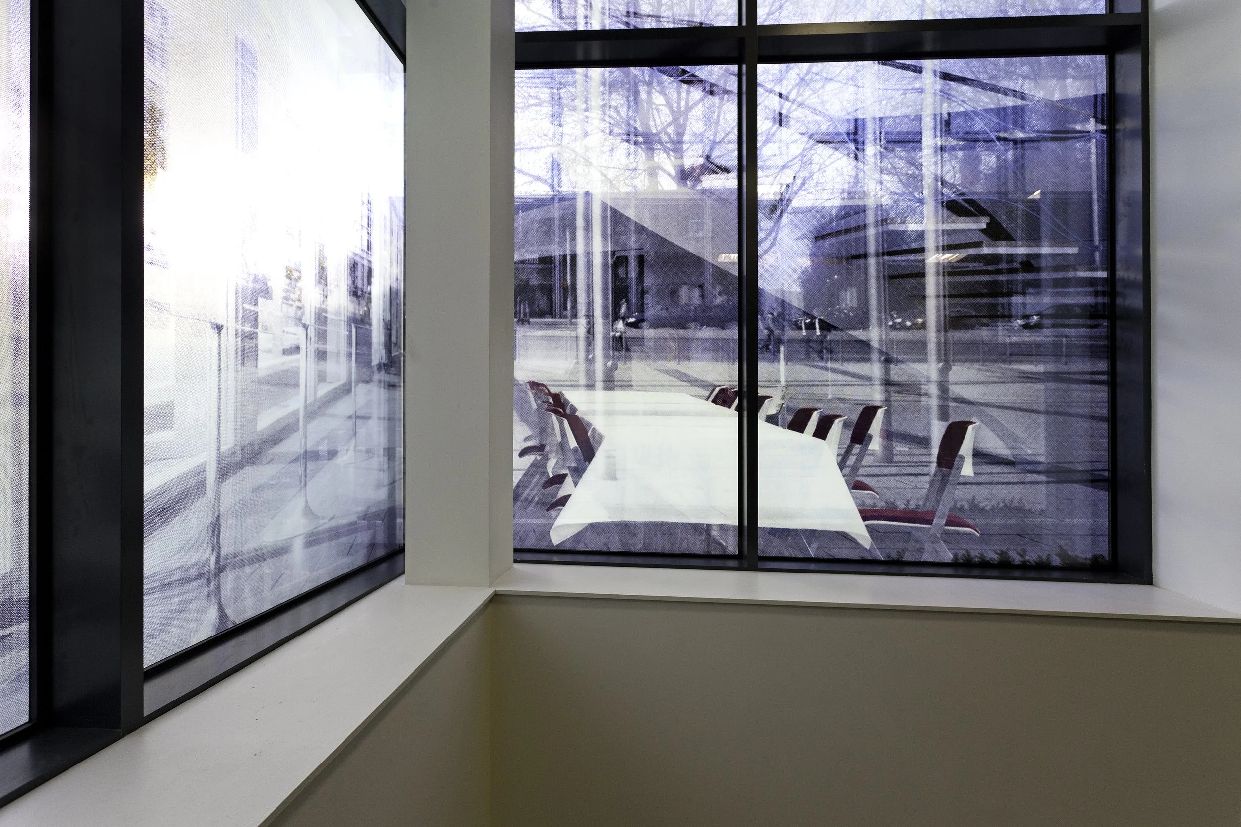 Sabine Hornig screen printed ceramic frit glass windows for Montpelier High School.