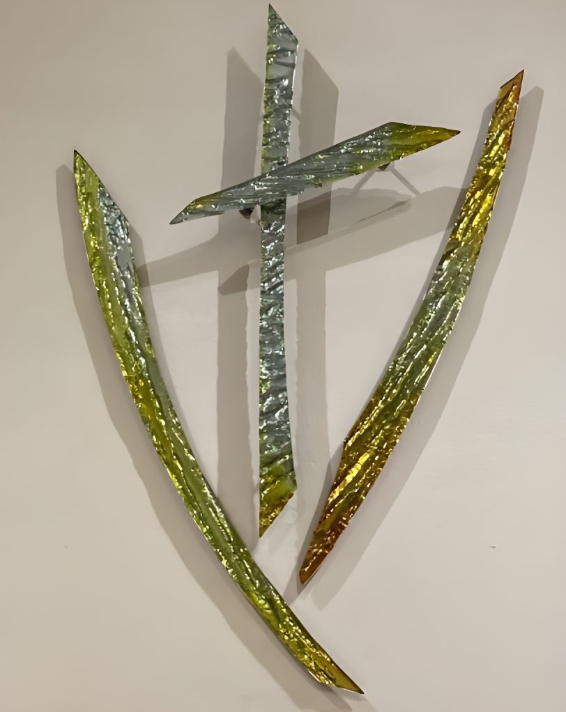 Slumped glass crucifix with side details featuring gold and silver metallic colouring by Jane Campbell.