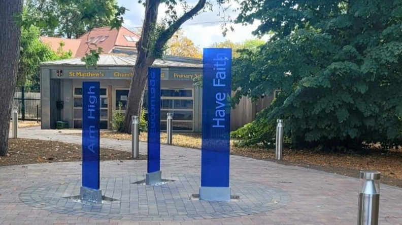 St Matthew's C of E Primary School coloured glass monoliths with deep etch