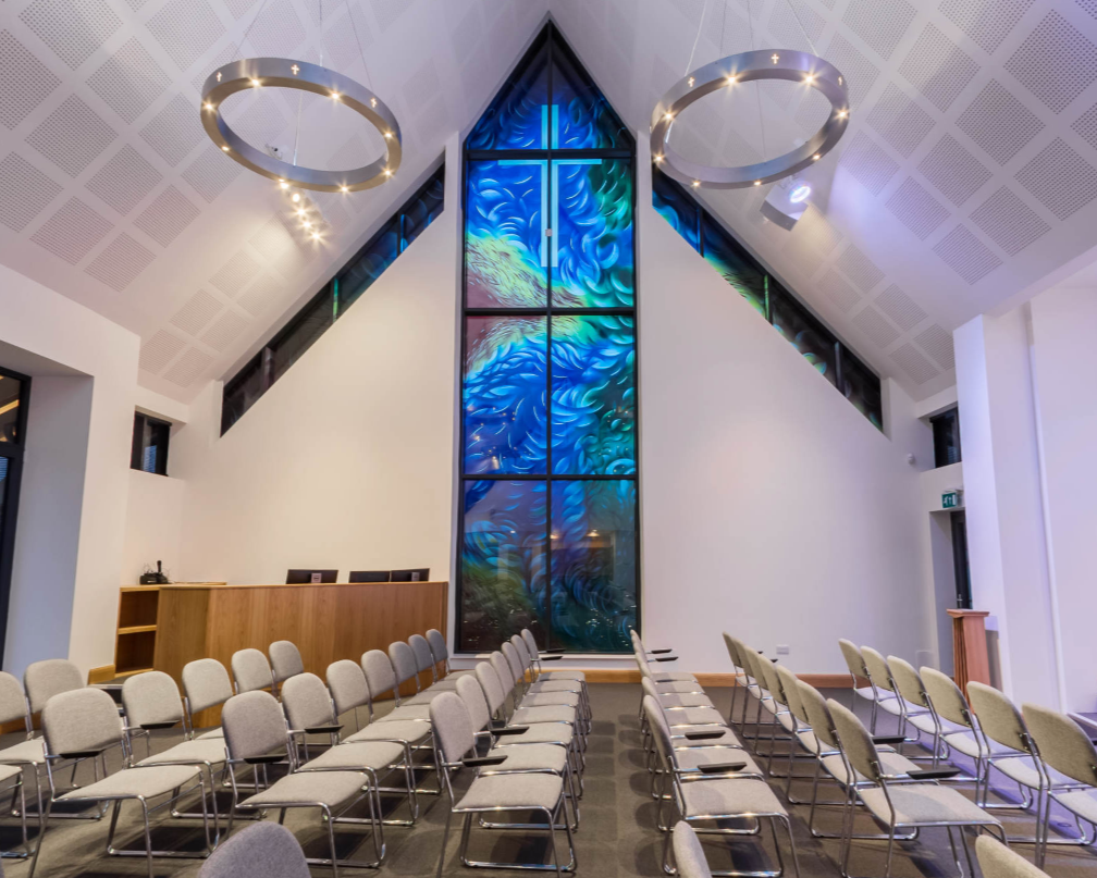 Opaque and transparent screen printed enamels on a modern church window.