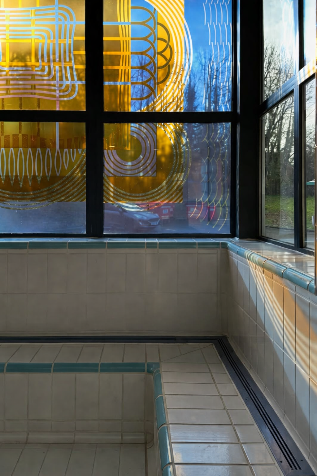 Tadley swimming pool transparent enamel coloured windows by Sasha Ward