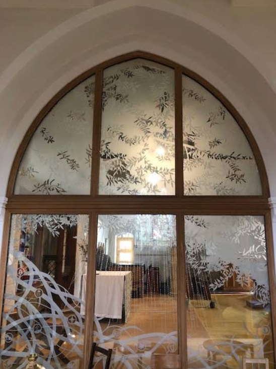 Ecclesiastical door incorporating etched leaf design.