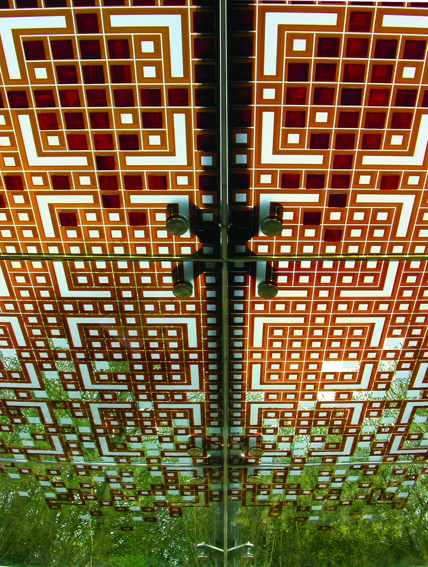 Suspended glass canopy featuring enamelled and laminated panels, with complete structural design accounting for wind pressure and snow loads