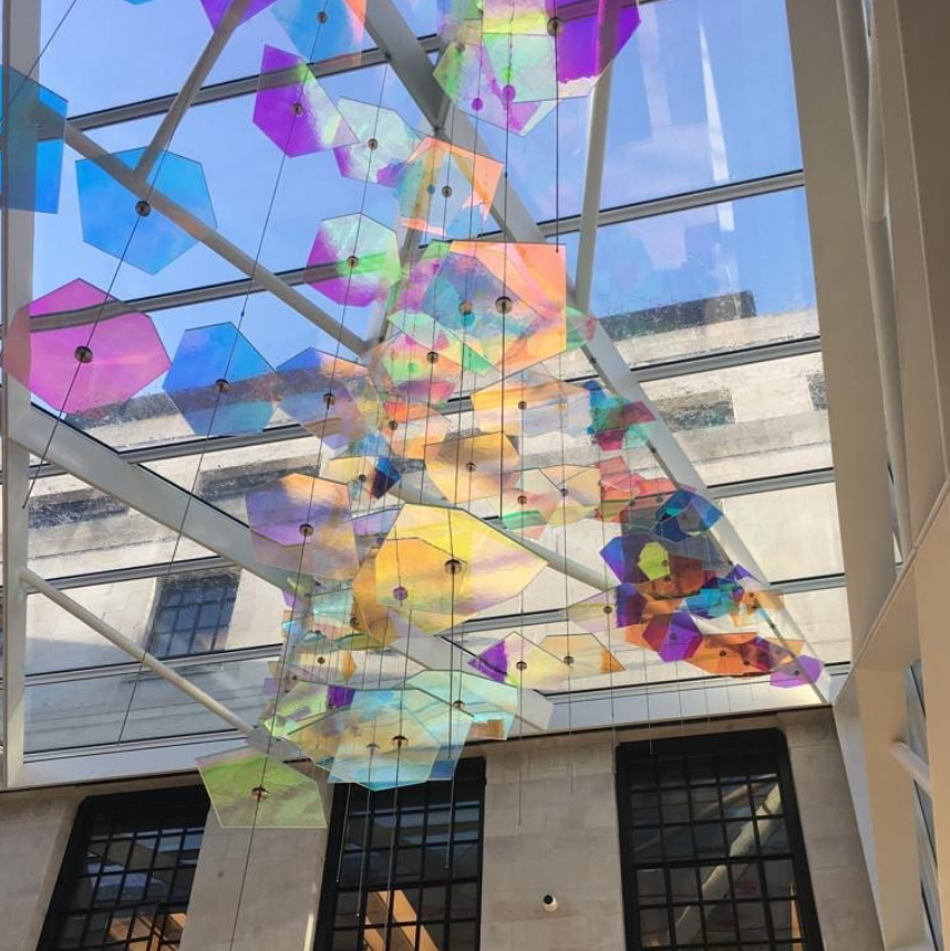 Fenella Osborne's dichroic glass sculpture hanging in the Sammy Ofer centre of the London Business School.