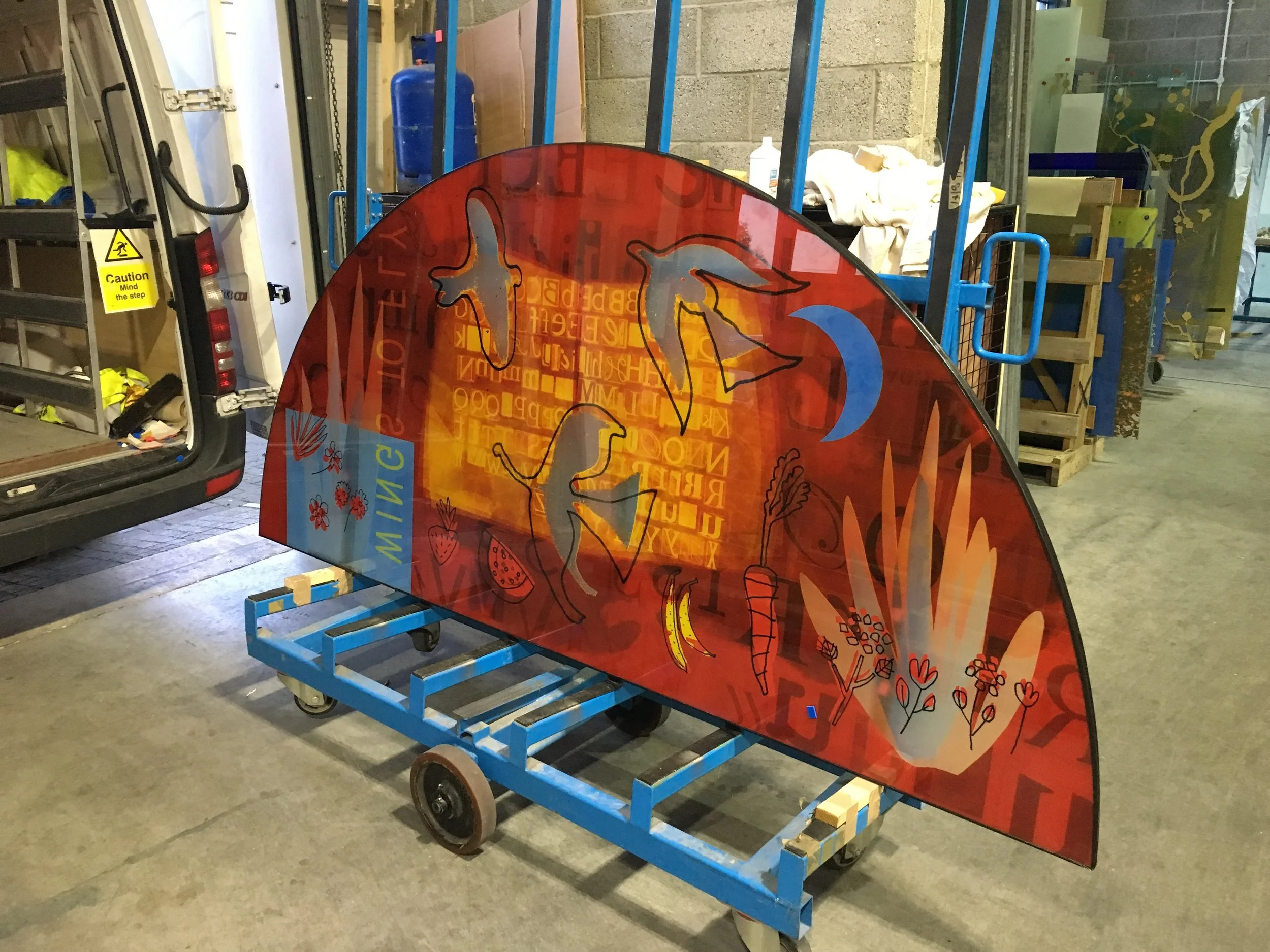 Stained glass curved window for Newnham Croft Primary School by Martin Donlin.