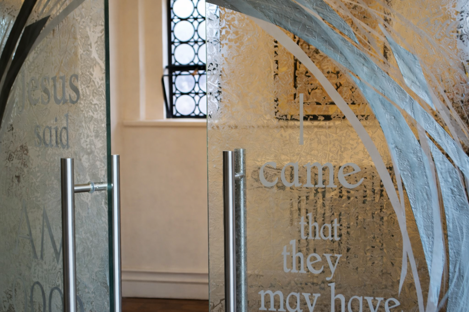 Etched scriptures on glass doors at Wrekin college