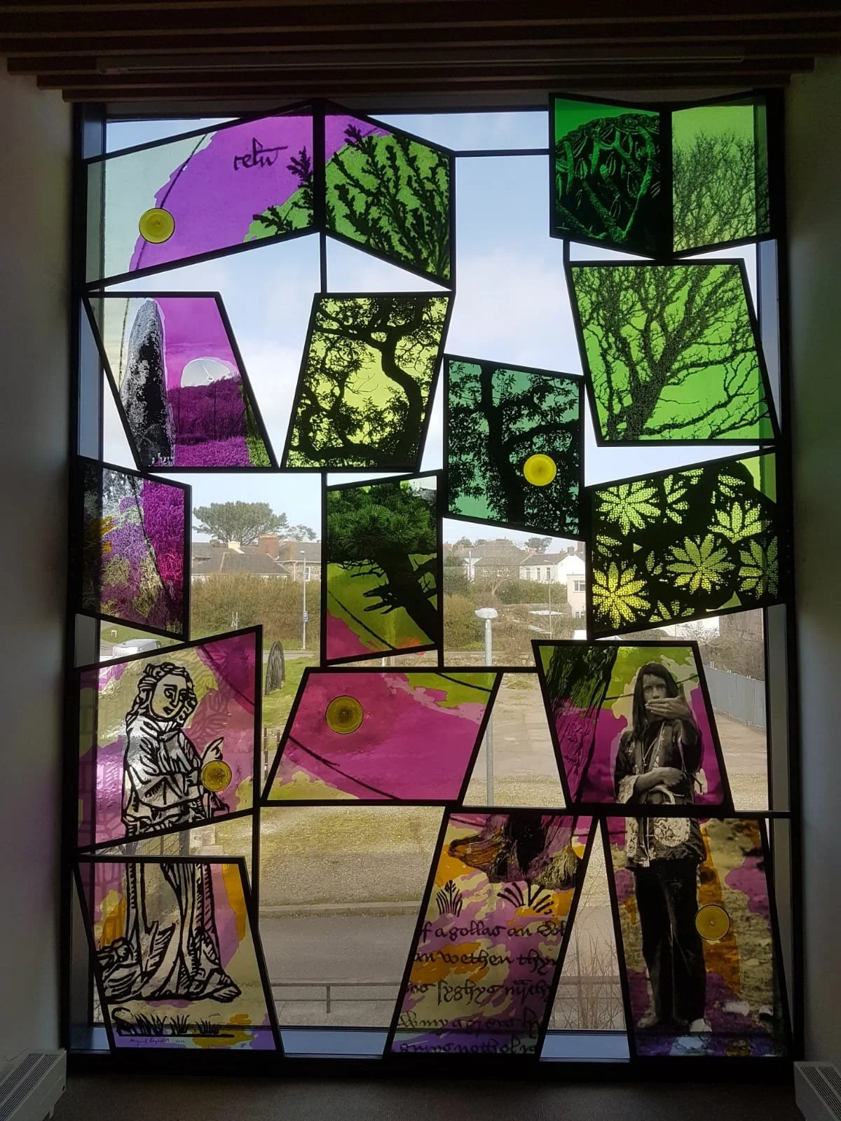 Abigail Reynolds 4m high glass window 'Tre' installed in the library at Kresen Kernow