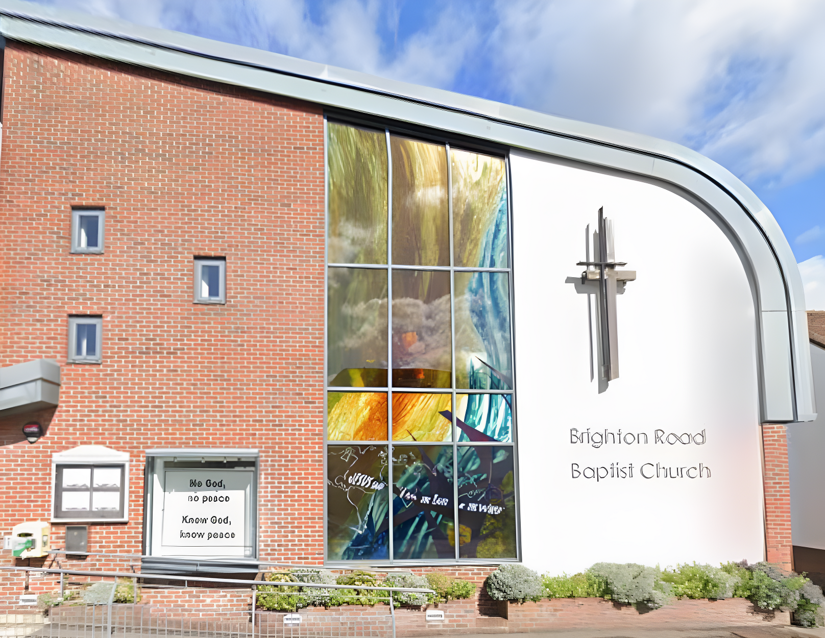Modern stained glass to a new church. Screen printed transparent enamels in a watercolour design.
