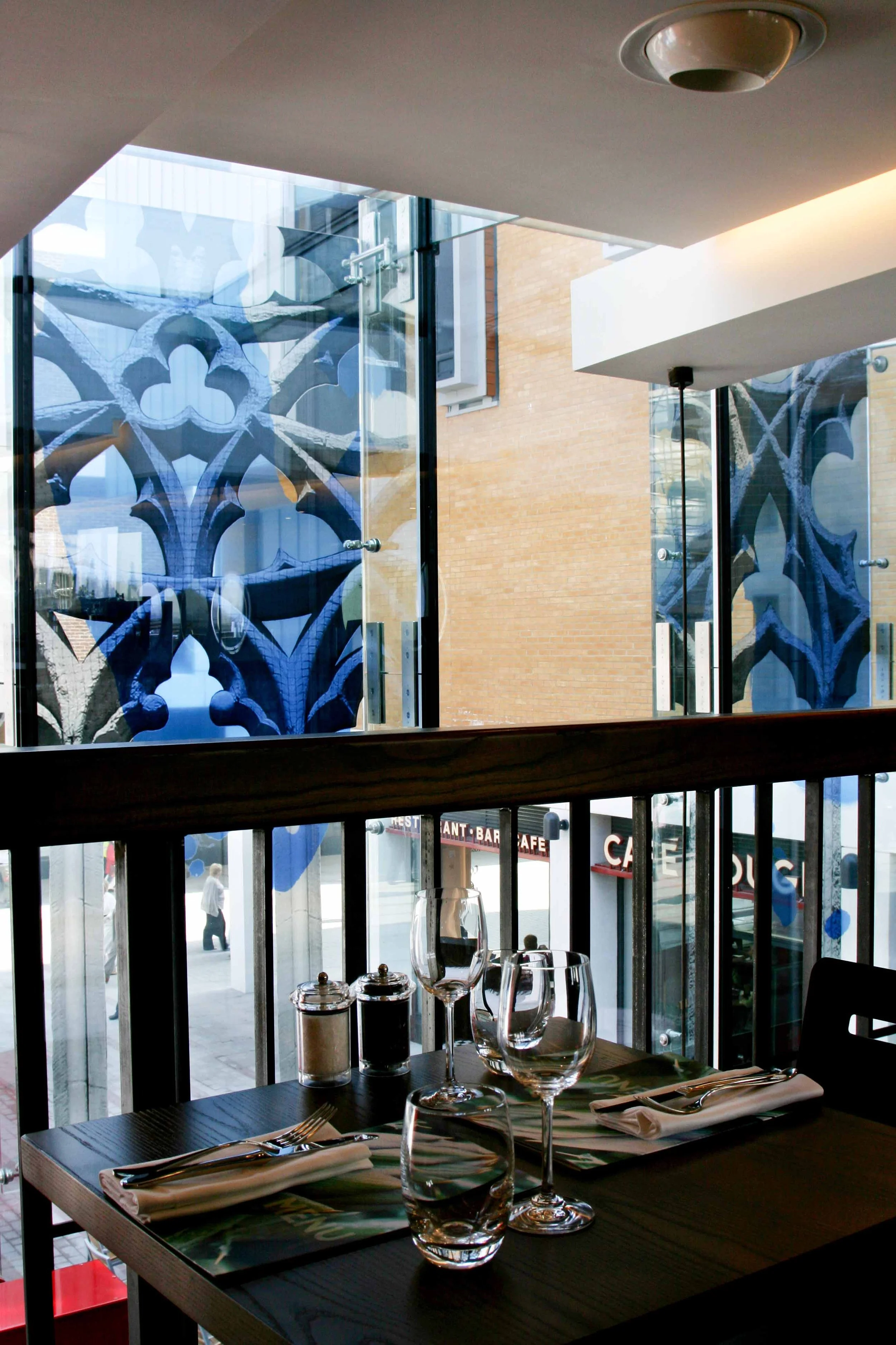 Enamelled screen printed glass facade shopping centre restaurant