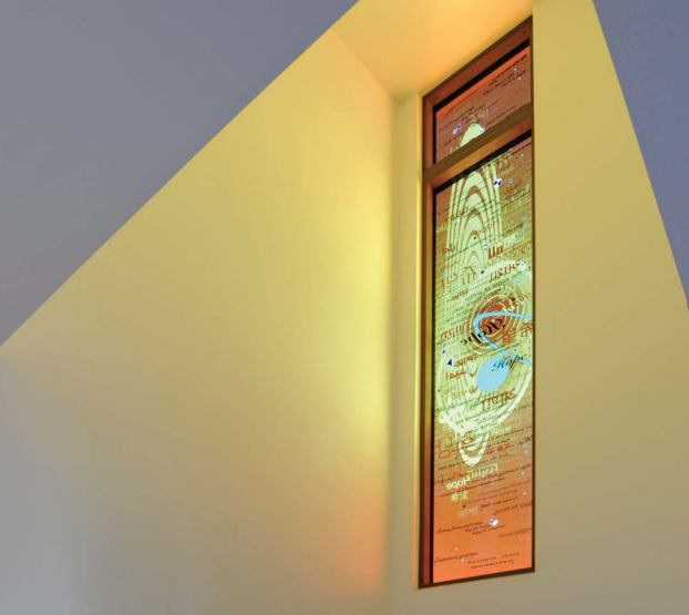 Modern stained glass in a hospital chapel. The work was screen printed in ceramic enamels.