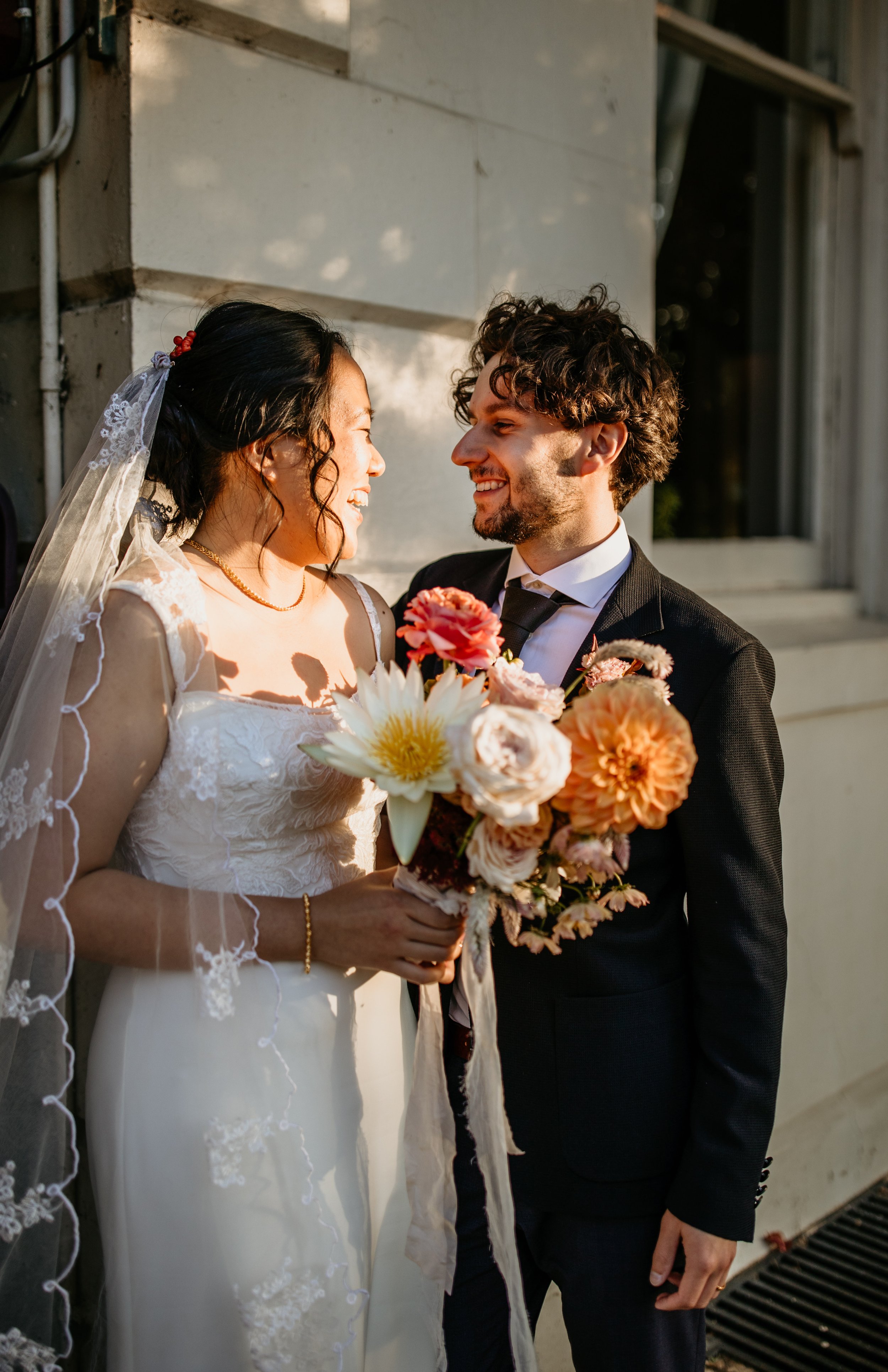 Bride and Groom holding wedding flowers