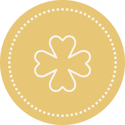 Gold medal with a four-leaf clover symbol in the center.
