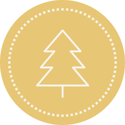 Gold medal with a white outline of a Christmas tree in the center.
