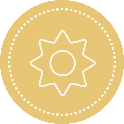 A gold-colored circular badge with a white outline of a sun or star in the center and dotted border around the edge.