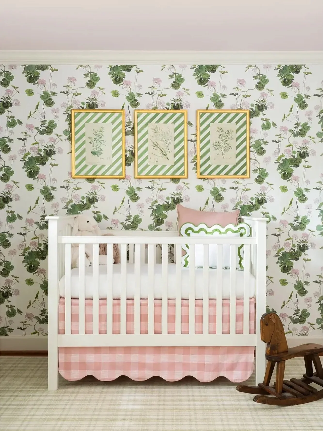 Blushing over these garden-inspired designs.

Perfectly sweet and timeless, this floral nursery feels like spring all year long. The botanical prints, framed in custom striped mats and gold moulding, add a layer of charm and sophistication to this wh