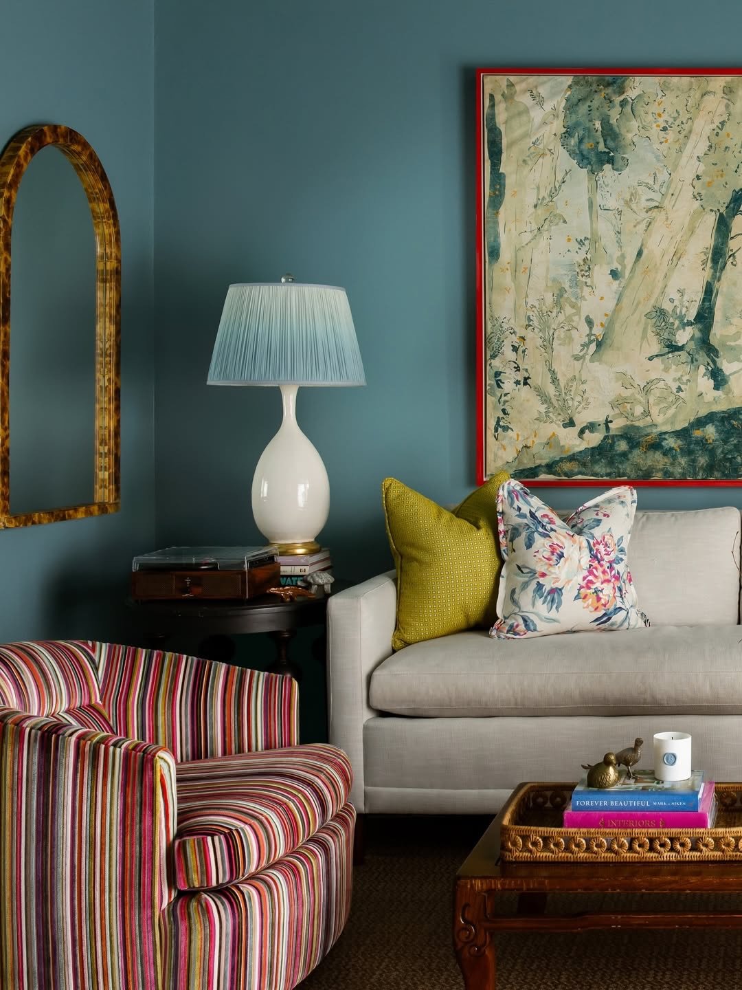 When a striking piece of art does all the talking.

This custom framing moment was all about letting the artwork lead. The bold red frame was intentionally chosen to echo the energy within the piece while anchoring it beautifully against those rich b