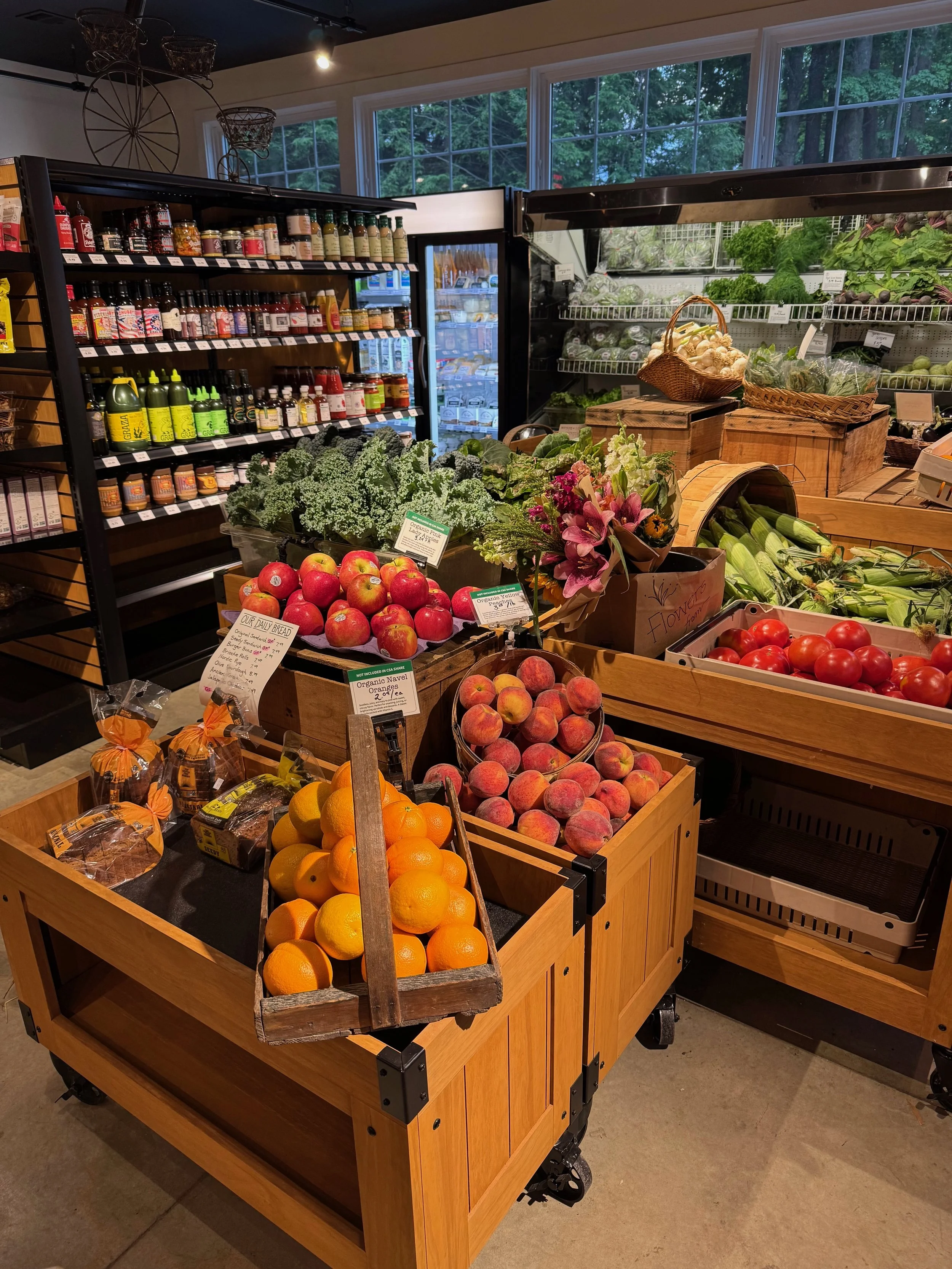 Produce displays and local pantry shelves inside Red Shirt Farm Market in Lanesborough, MA