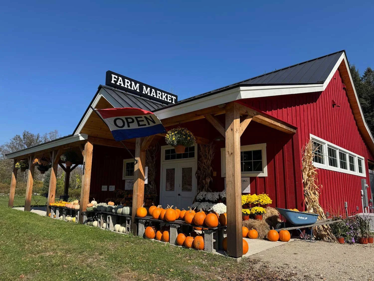 Exterior of Red Shirt Farm Market on Route 7 in Lanesborough MA  in fall with pumpkins and seasonal displays