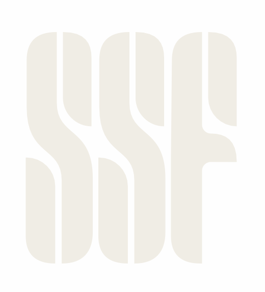 Text-based logo with large, light beige capitalized letters spelling 'SUSE' vertically aligned.