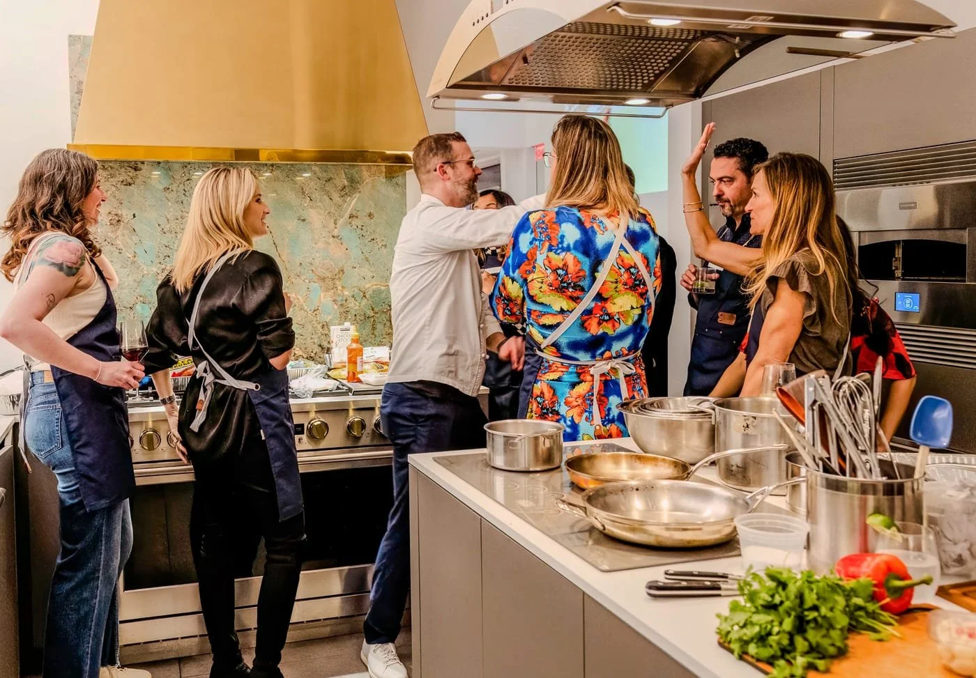 Corporate guests participating in an Iron Chef team building experience at The Luxury Tree House in Houston.