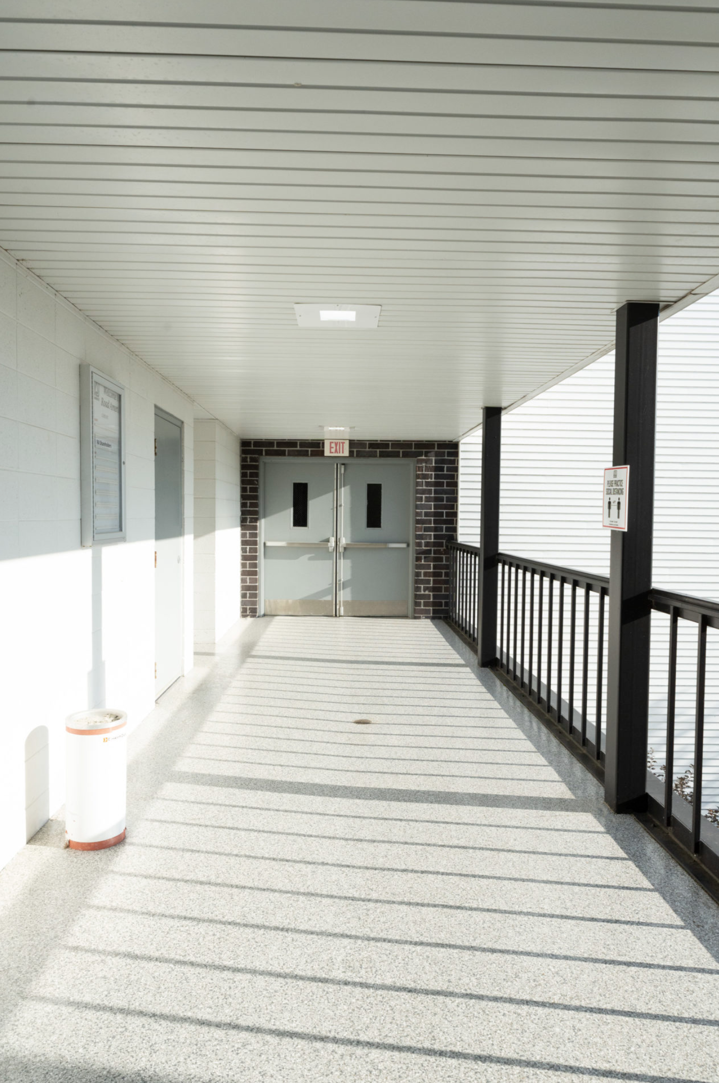 Interior hallway with double doors and exit sign