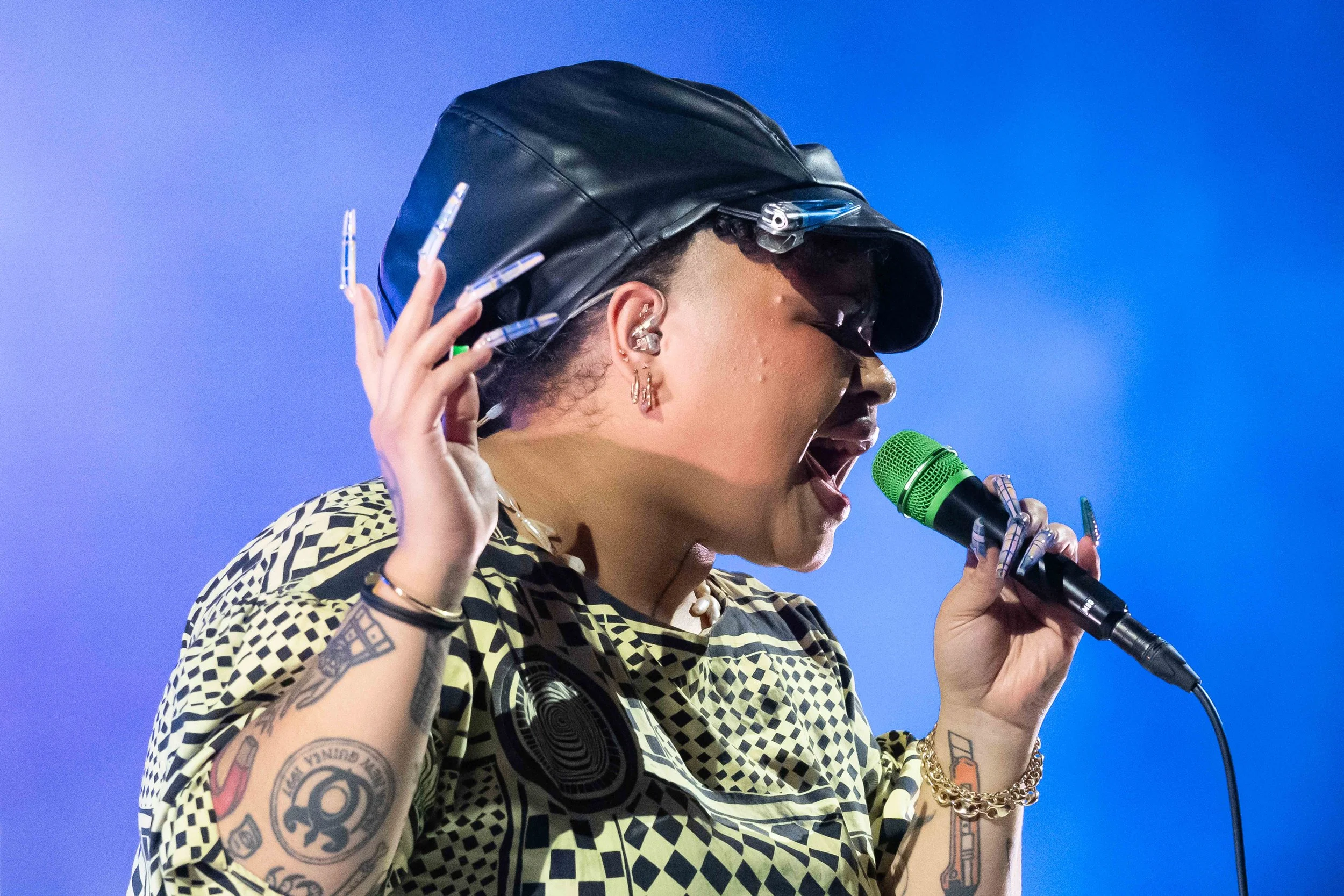 Singer on stage with a blue foggy background