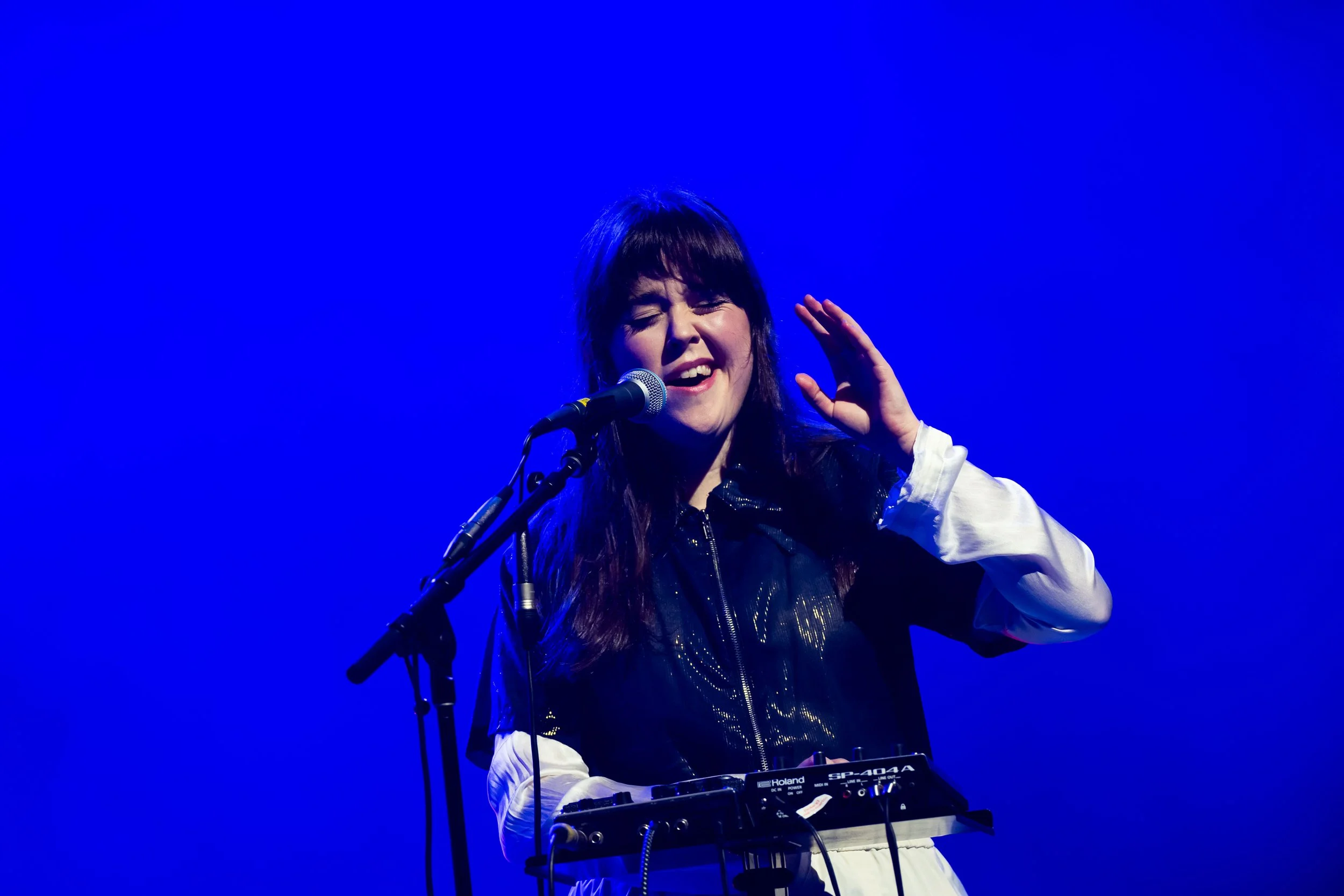 A female singer performs on stage