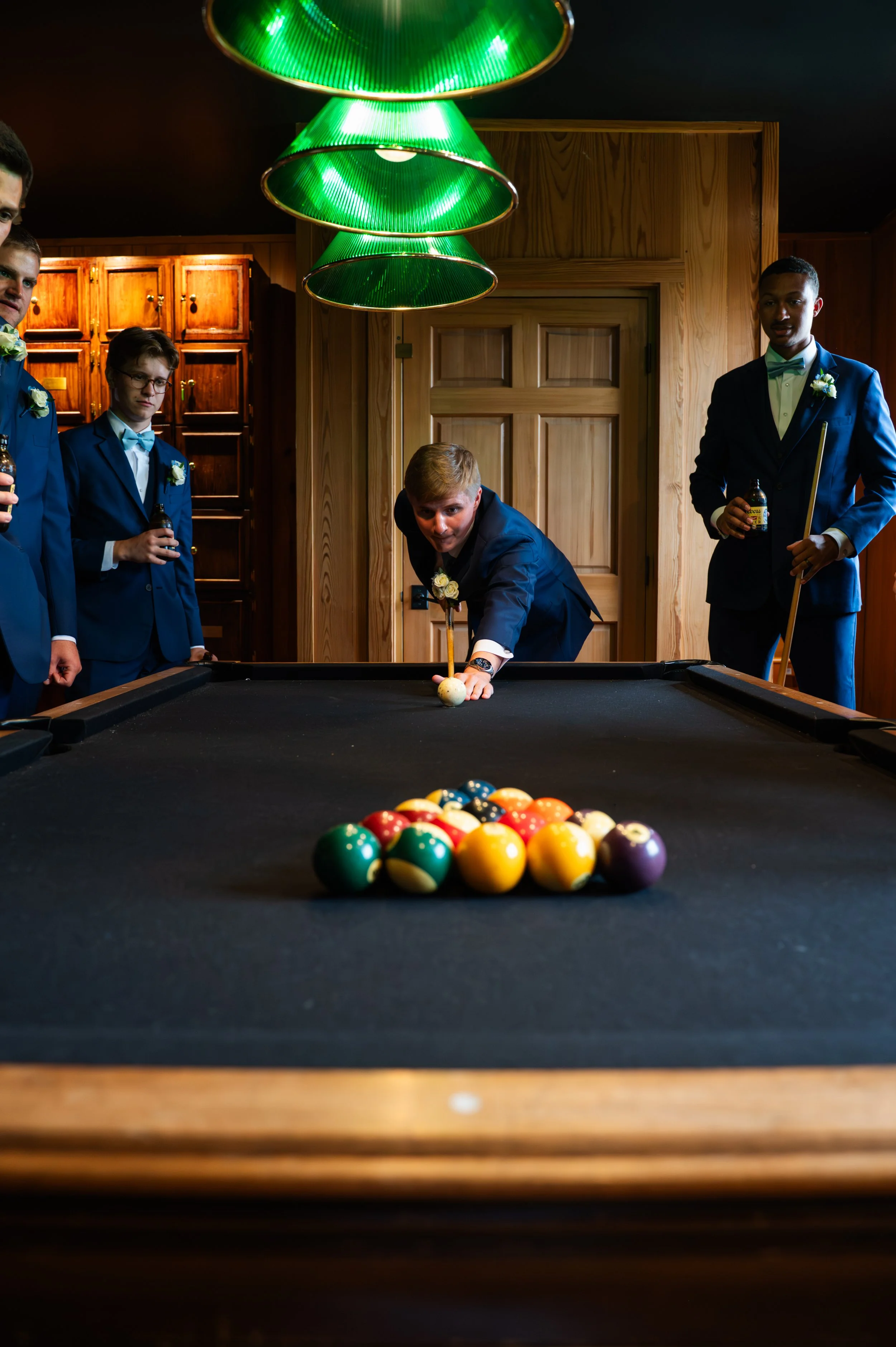 Matt plays pool with his groomsmen while getting ready upstairs at Gypsy Distillery.