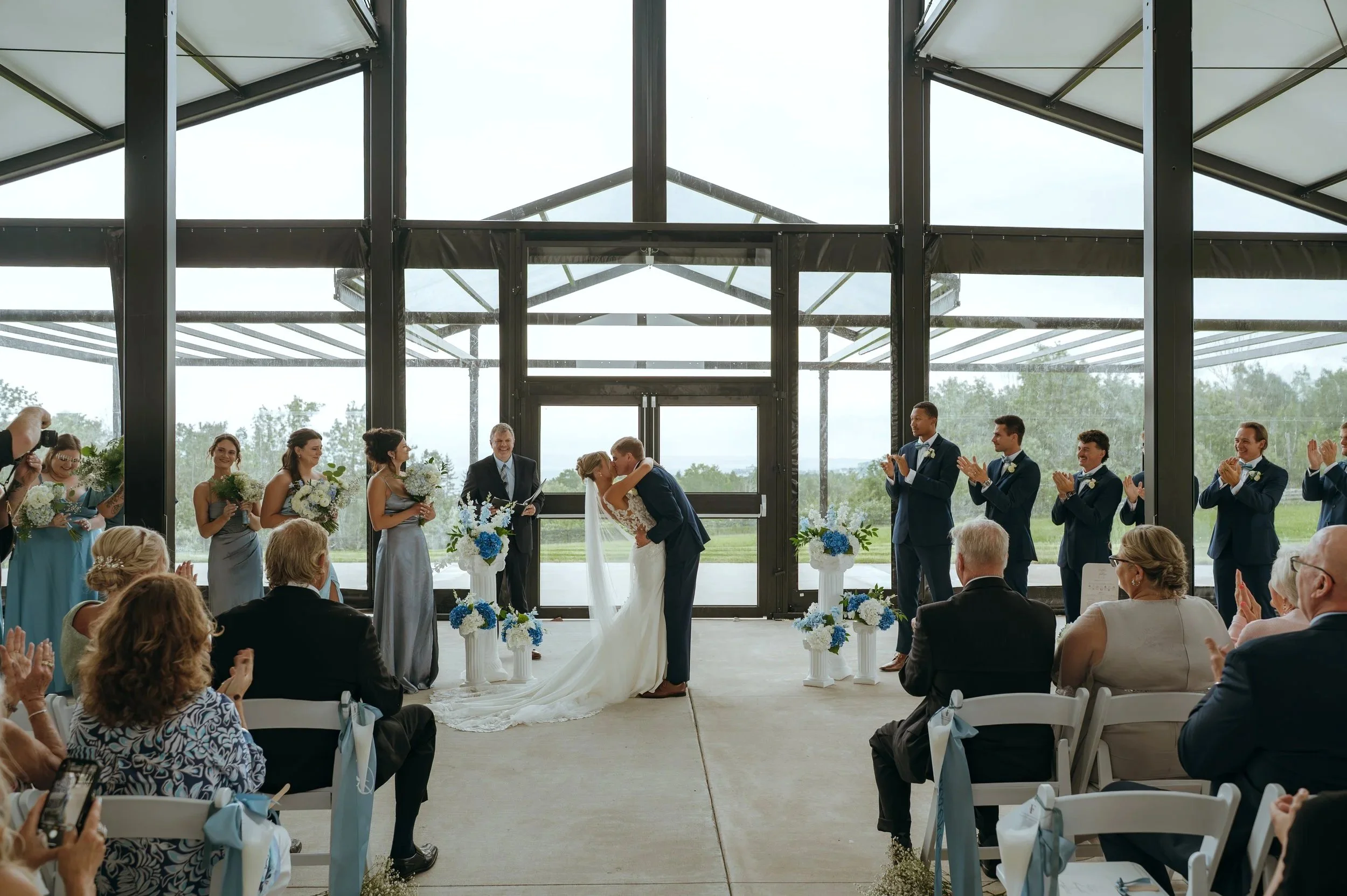 Sydney and Matt share their first kiss during their wedding ceremony at Gypsy Distillery.