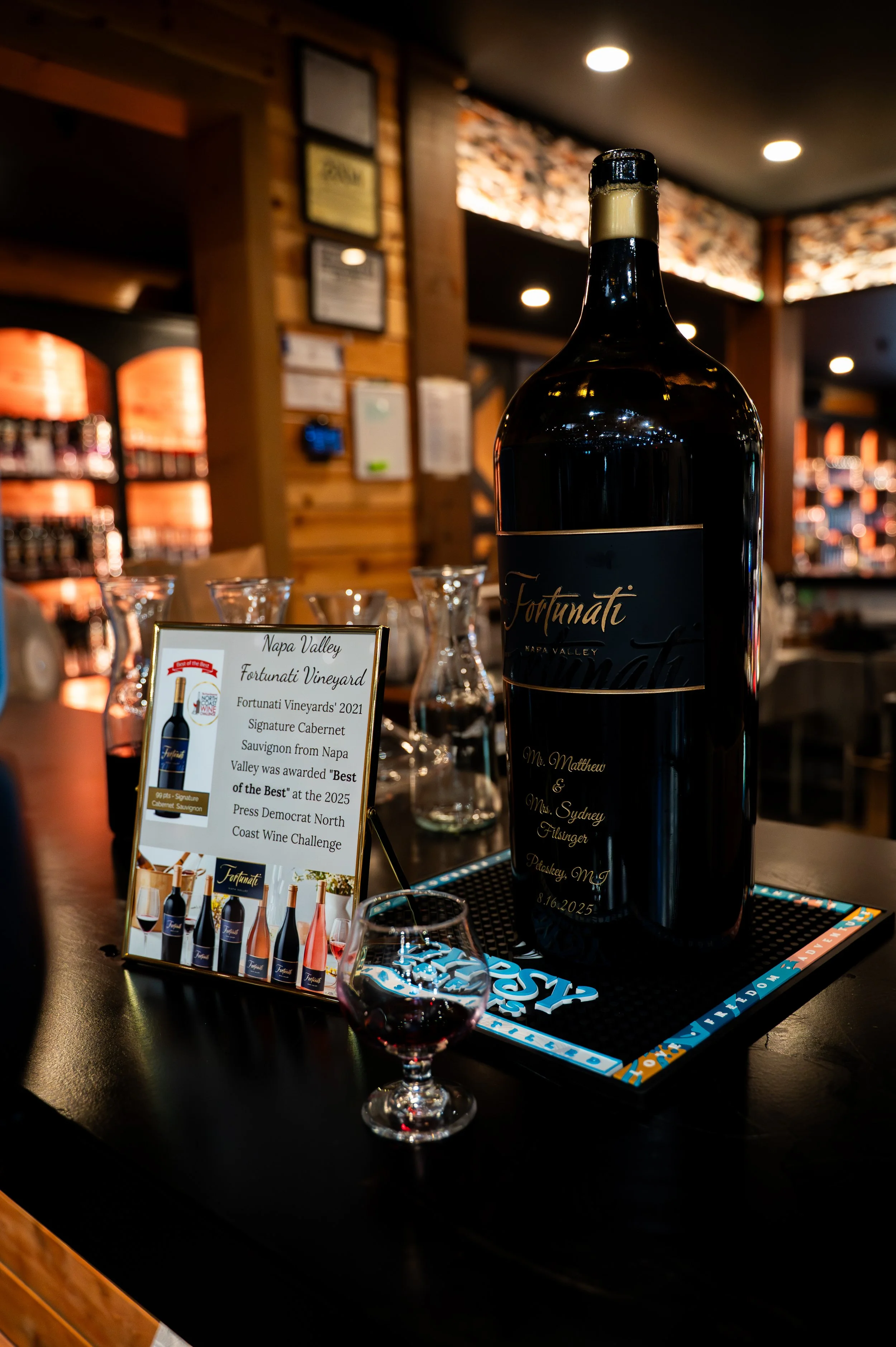Personalized wine bottle engraved for Sydney and Matt’s wedding reception in Petoskey, Michigan.