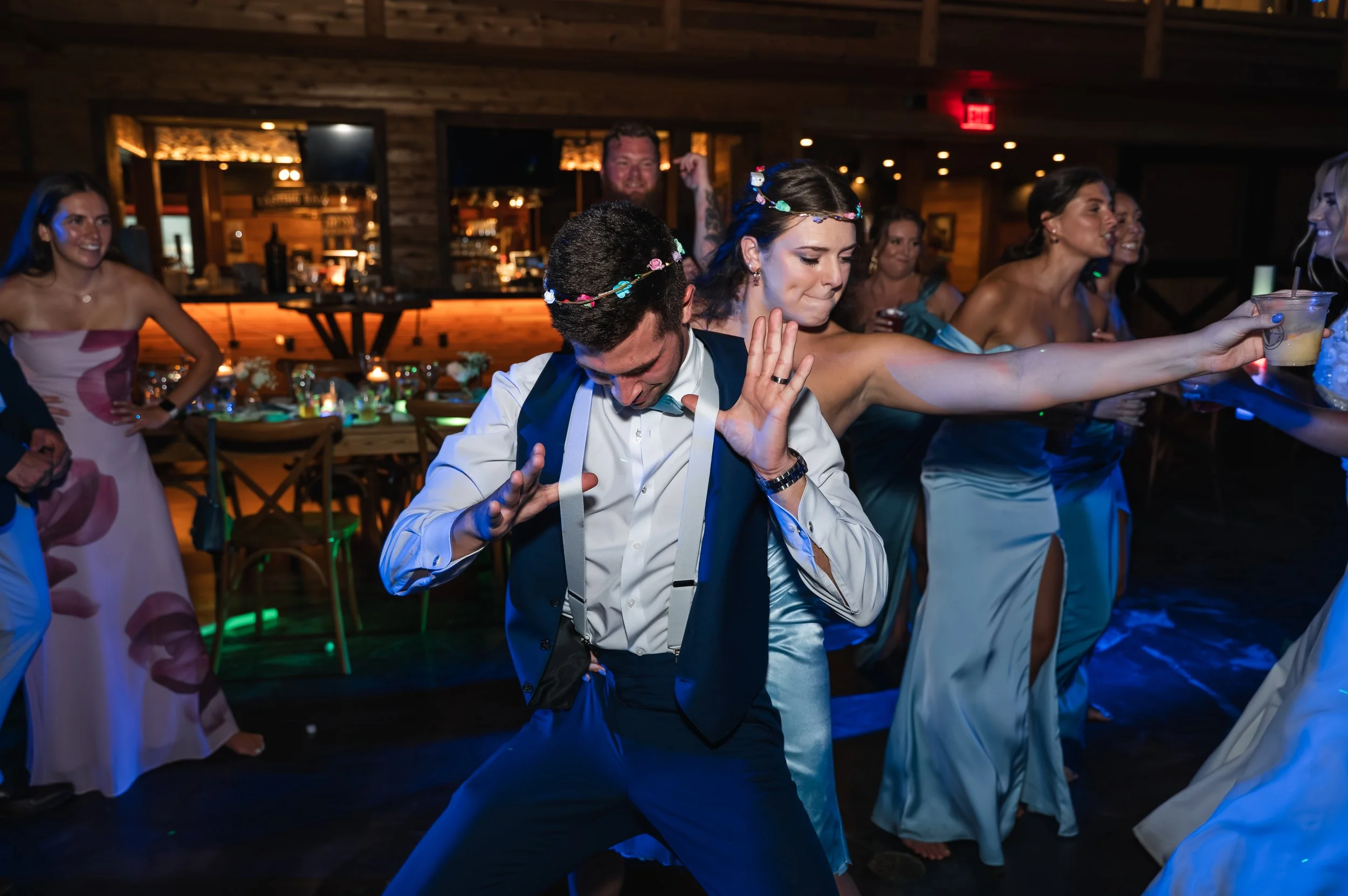 Sydney laughs and dances with her bridesmaids and friends during her wedding reception at Gypsy Distillery.