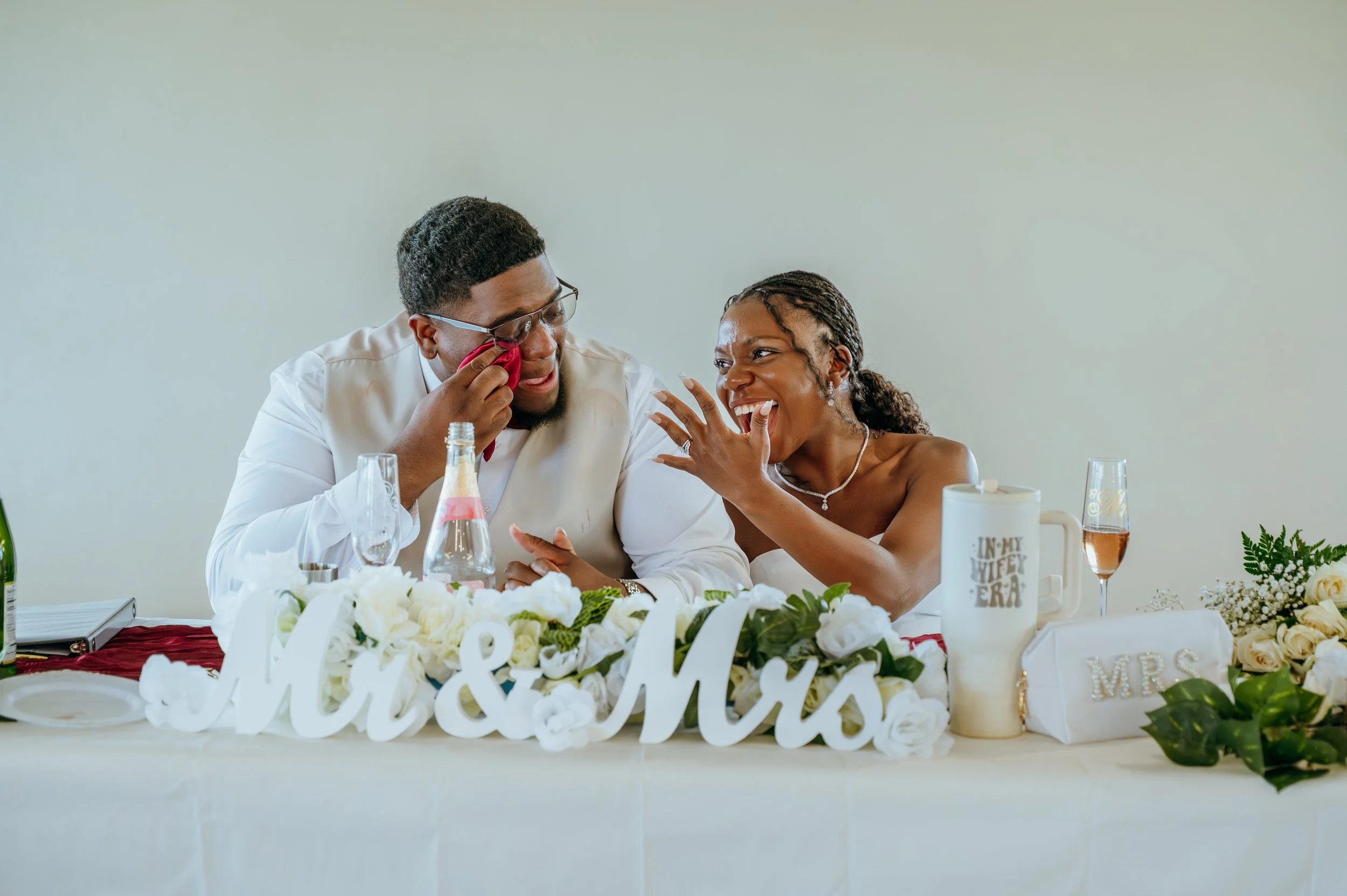 Diego wipes away tears as Anndi laughs beside him during an emotional wedding reception speech.