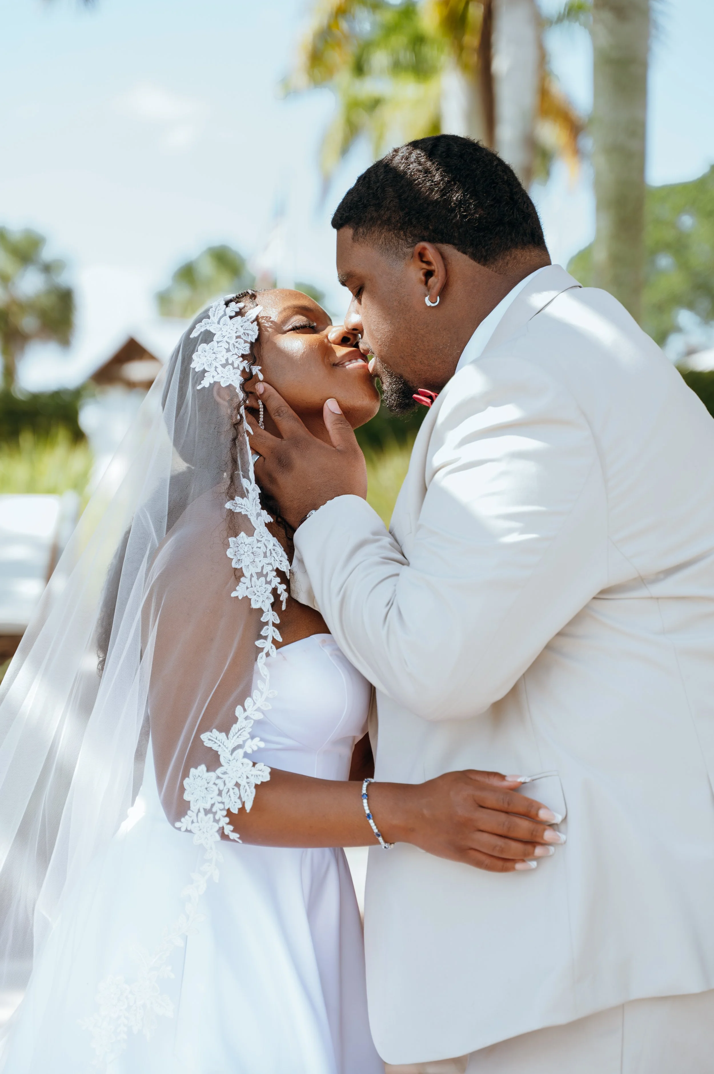 Intimate close-up wedding portrait of Anndi and Diego embracing outdoors.