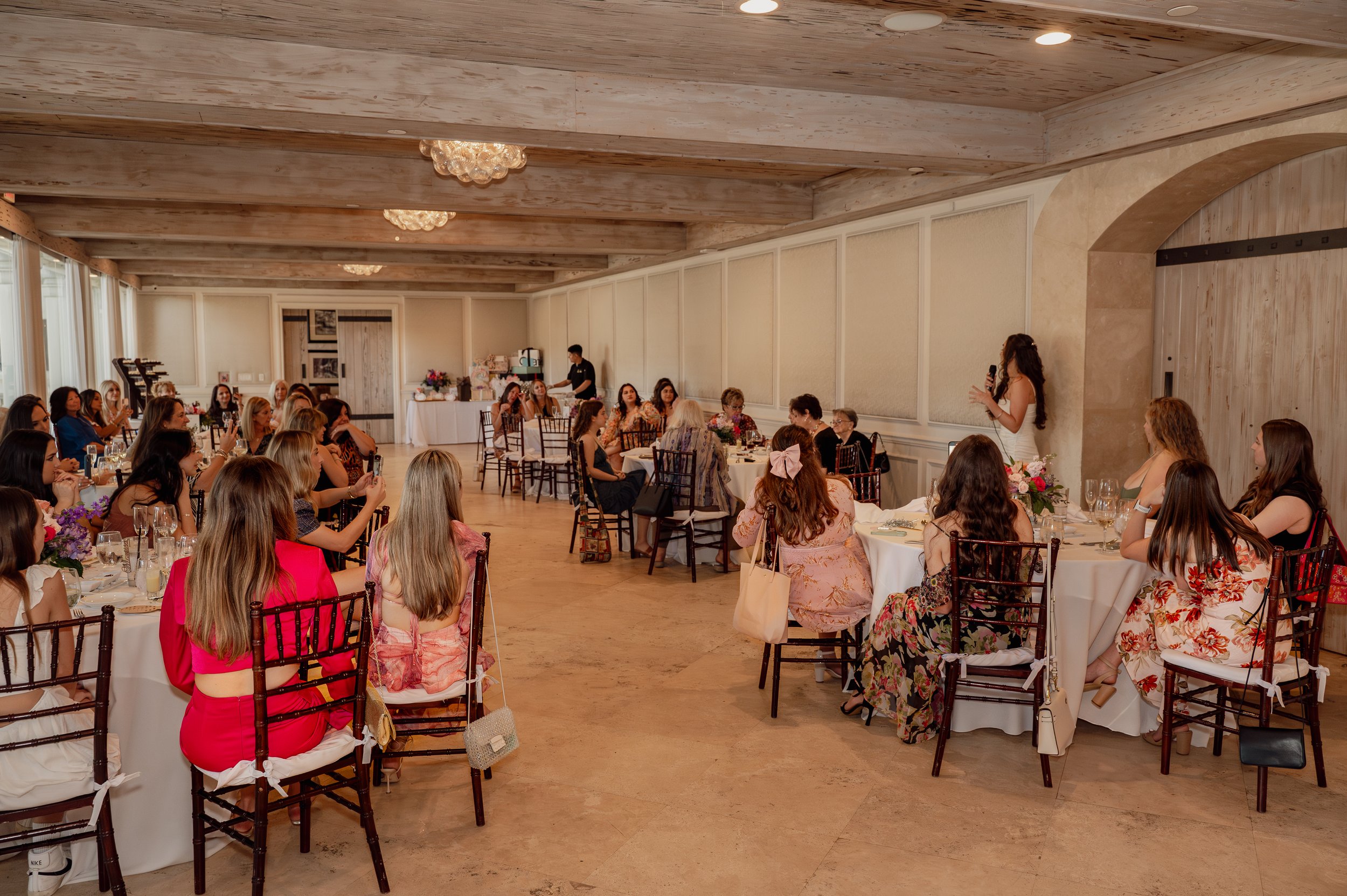 Guests celebrating Olivia’s bridal shower inside The Addison in Boca Raton, Florida.