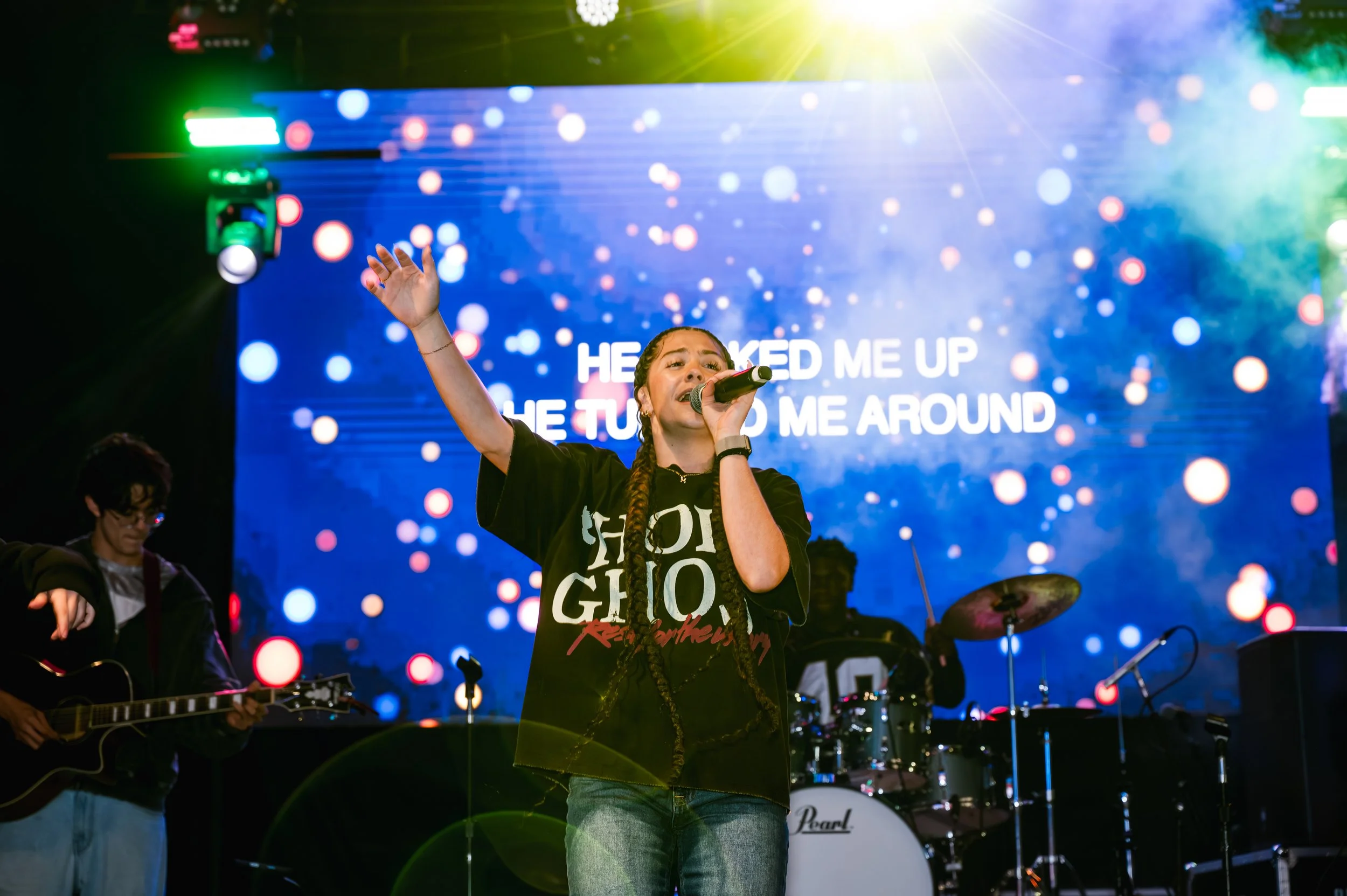 Vocalist performing onstage at the Young in Faith event at the South Florida Fairgrounds.