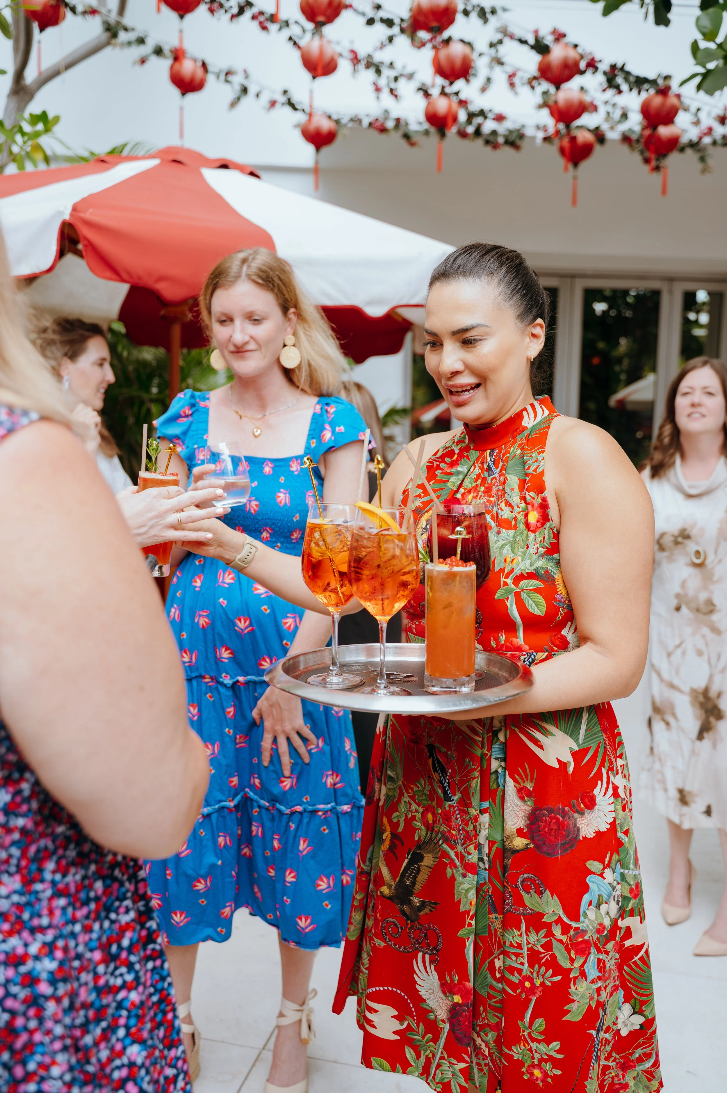 Server carrying cocktails through a CBRE corporate event at Faena Miami Beach.