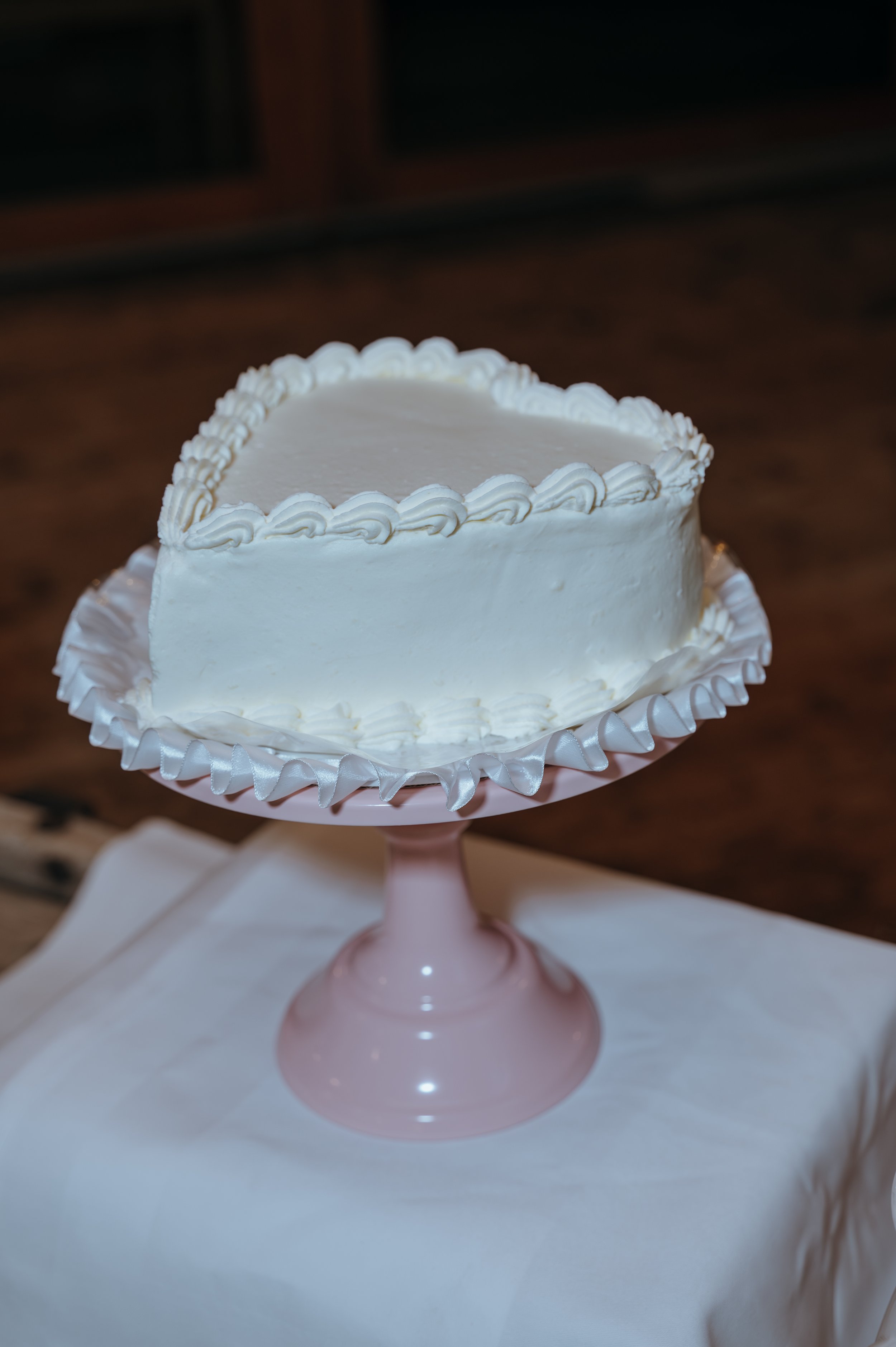 Malwina and Matthew’s wedding cake displayed during their reception at Jucker Farm in Switzerland