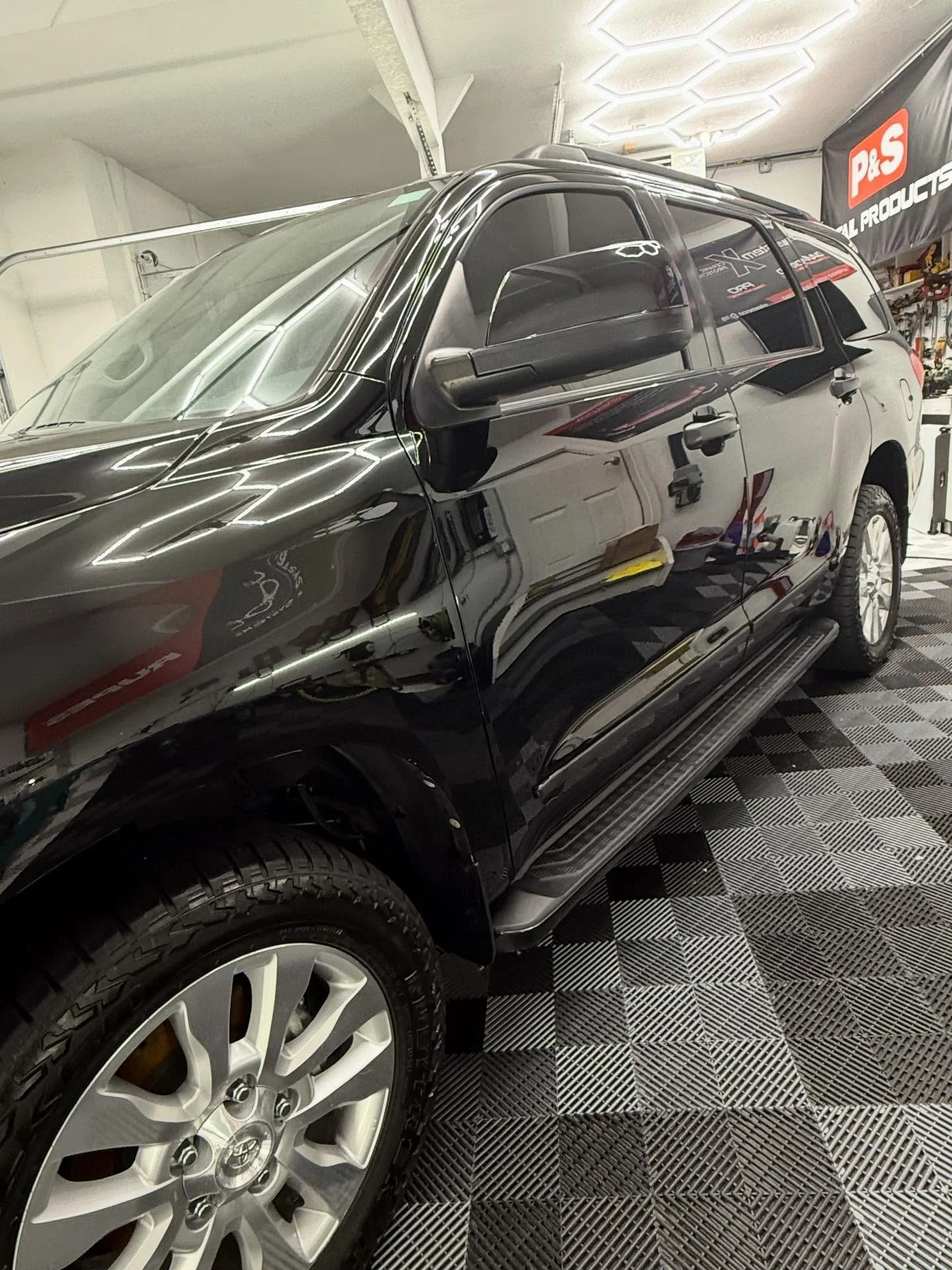 This 2011 Toyota Sequoia got a makeover! Started off with wet sanding. Proceeded to a 2 stage paint correction, a headlight restoration, swapped out the chrome door handles with black ones, and debadged it. Then it was topped off with a 10 year ceram