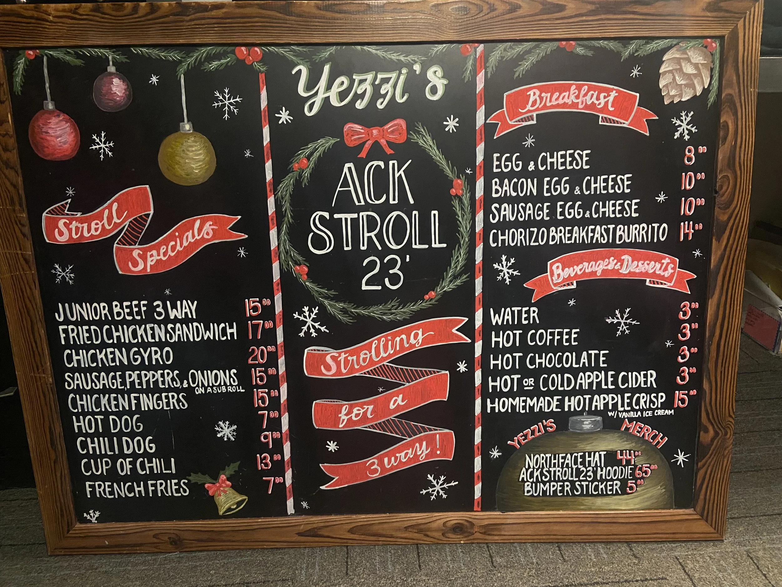 Yezzi’s ACK Stroll Holiday Menu. Hand-lettered holiday chalkboard menu for a restaurant, featuring custom illustrations, pricing layout, and festive branding.