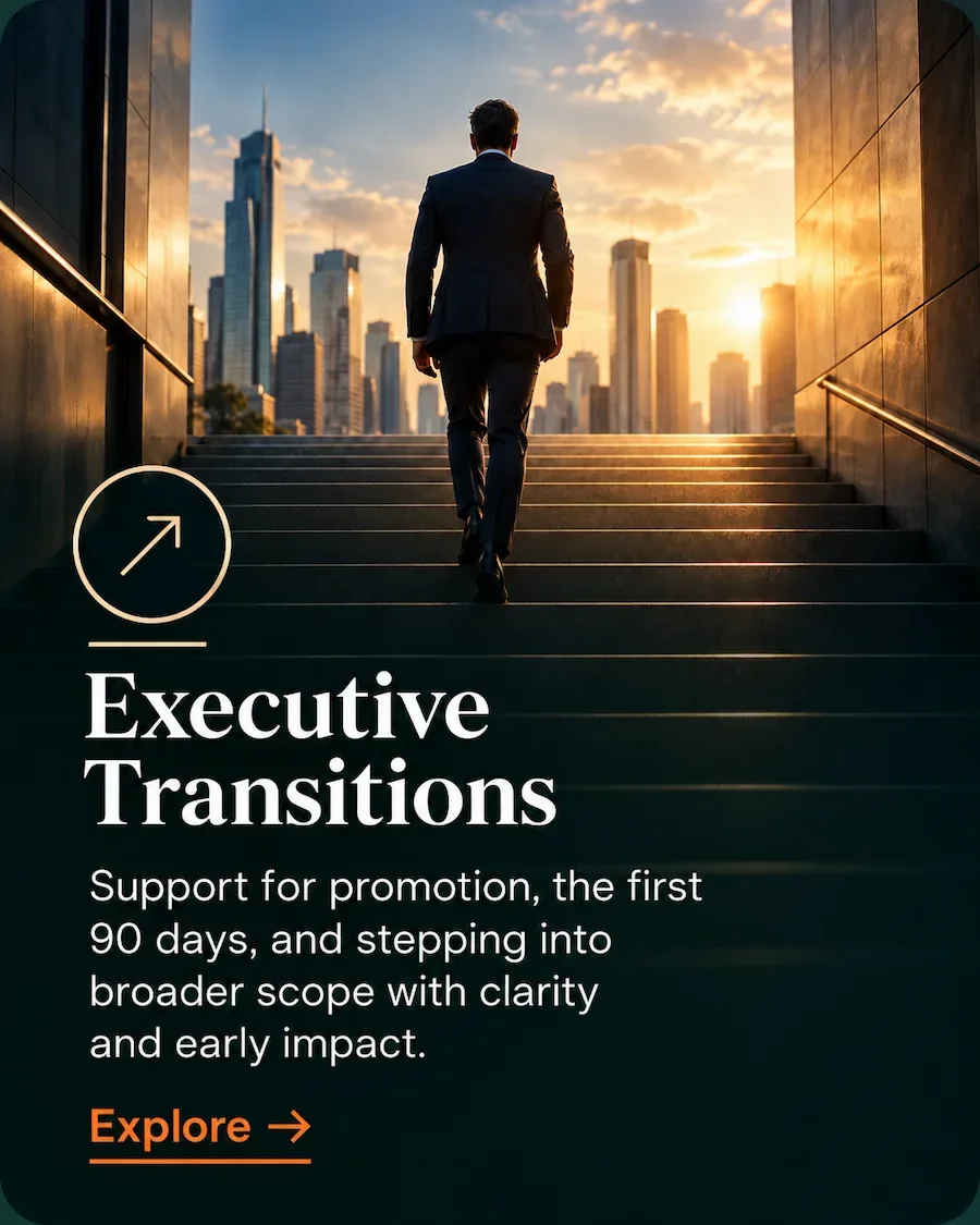 Senior executive walking up steps towards a city skyline, representing executive transition coaching.