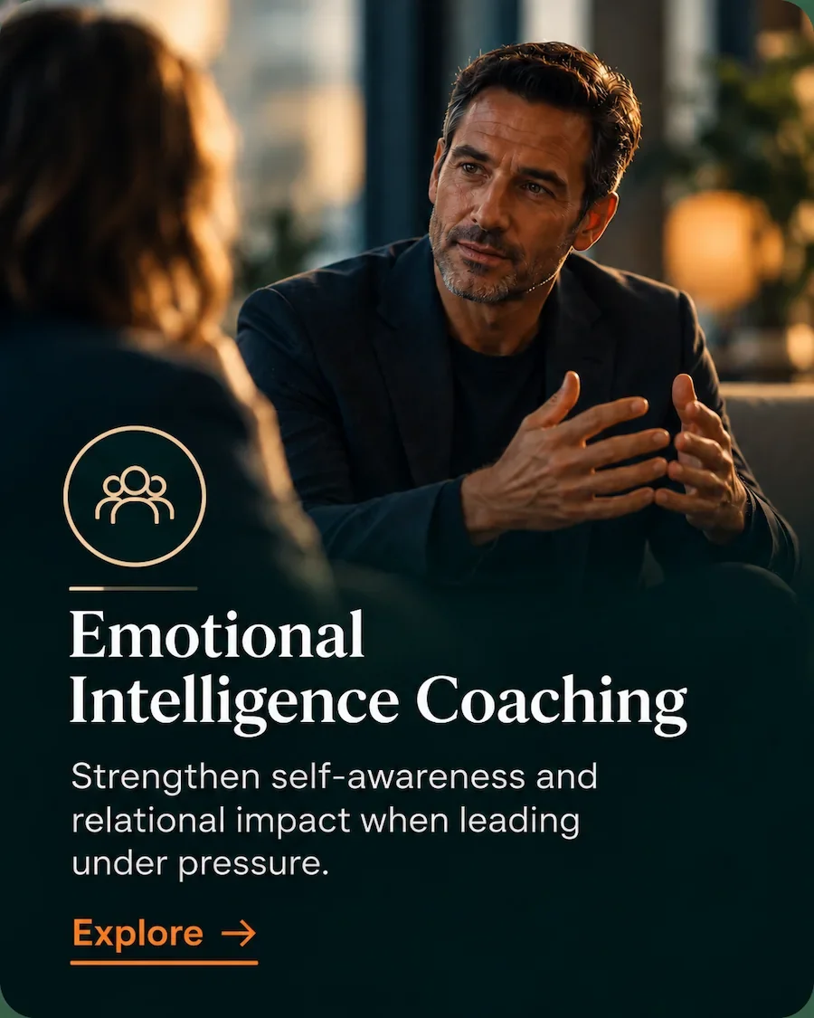 Senior leader in a focused conversation, representing emotional intelligence coaching and relational leadership.