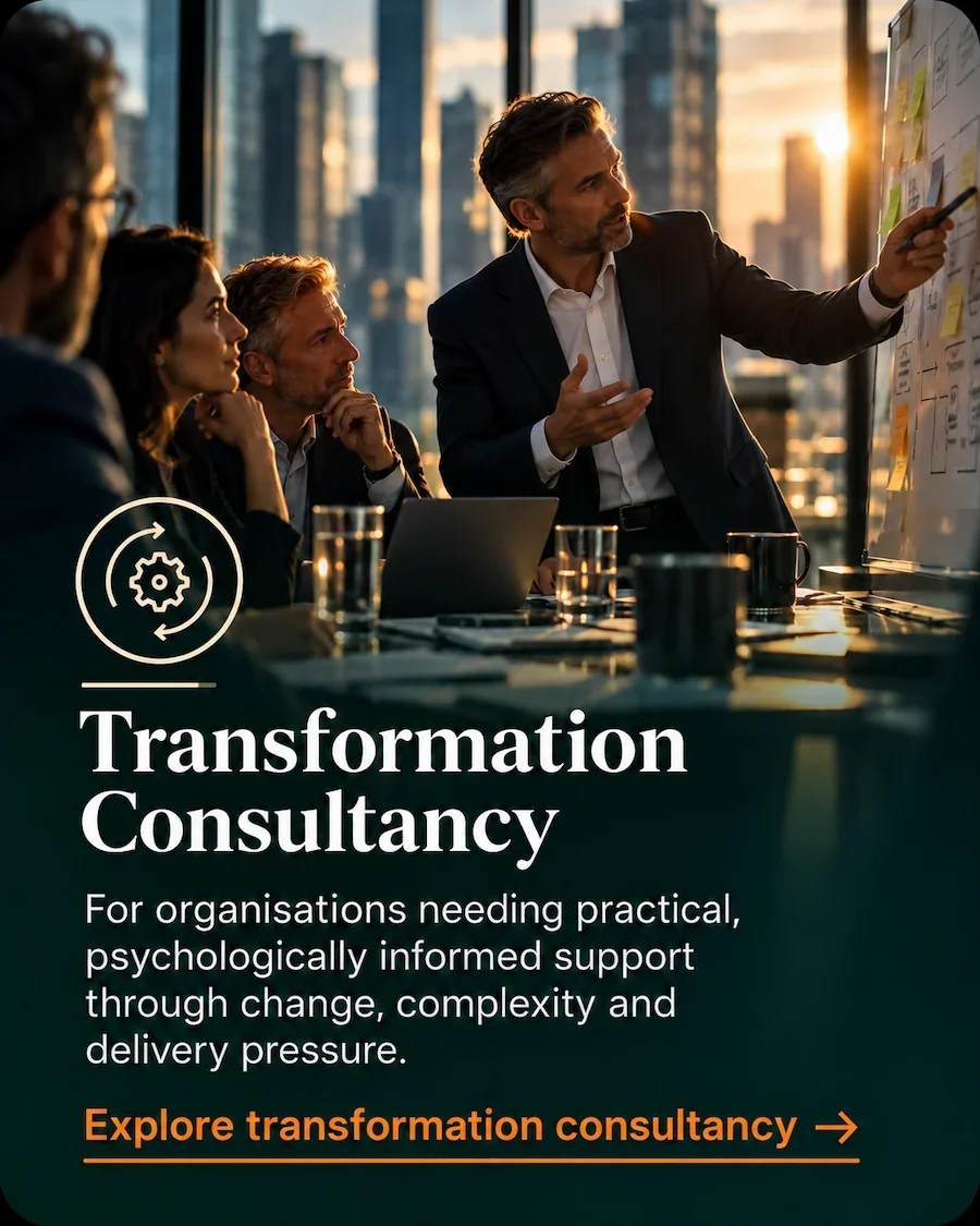 Senior leader facilitating a transformation workshop with colleagues, representing organisational change consultancy.